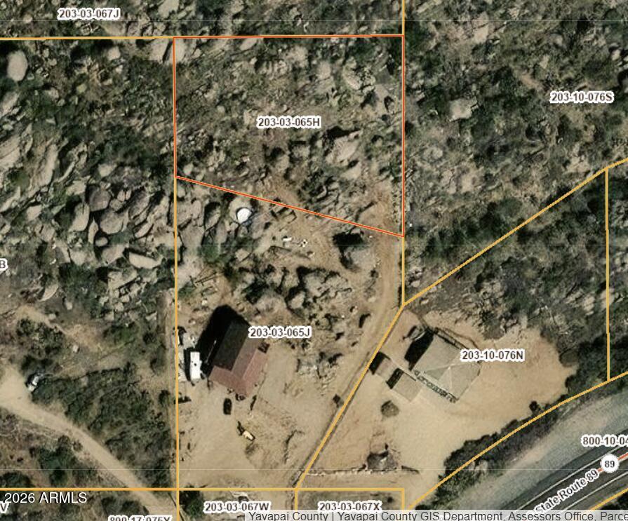 This rare undeveloped parcel offers the opportunity to build your custom residence or investment property in a well-situated rural neighborhood. Surrounded by natural desert terrain and panoramic views, the lot benefits from easy access to State Route 89 and is close to community amenities, dining, and outdoor recreation. Utility availability, exact acreage, and zoning to be verified by buyer. Perfect for those seeking privacy and mountain/desert vistas in Yavapai County.