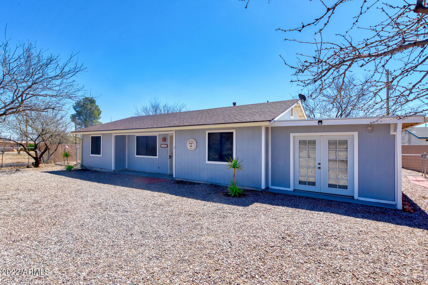 What a doll house!  This home is small but ''mighty'' boasting 3 bedrooms 2 baths, open concept floorplan, with upgraded appliances, countertops and new laminate flooring.  This property sits on .63 acres fully fenced with privacy fence on the north and south sides.  The back half of the property is fenced off from the house for a garden or whatever your imagination deems suitable!  The one car garage has been converted to a storage room which could be changed back to a garage, or possible additional square footage to the home!  This house has been ''loved'' and cared for.  Don't miss your opportunity to see it for yourself!  Call today for a private showing.
