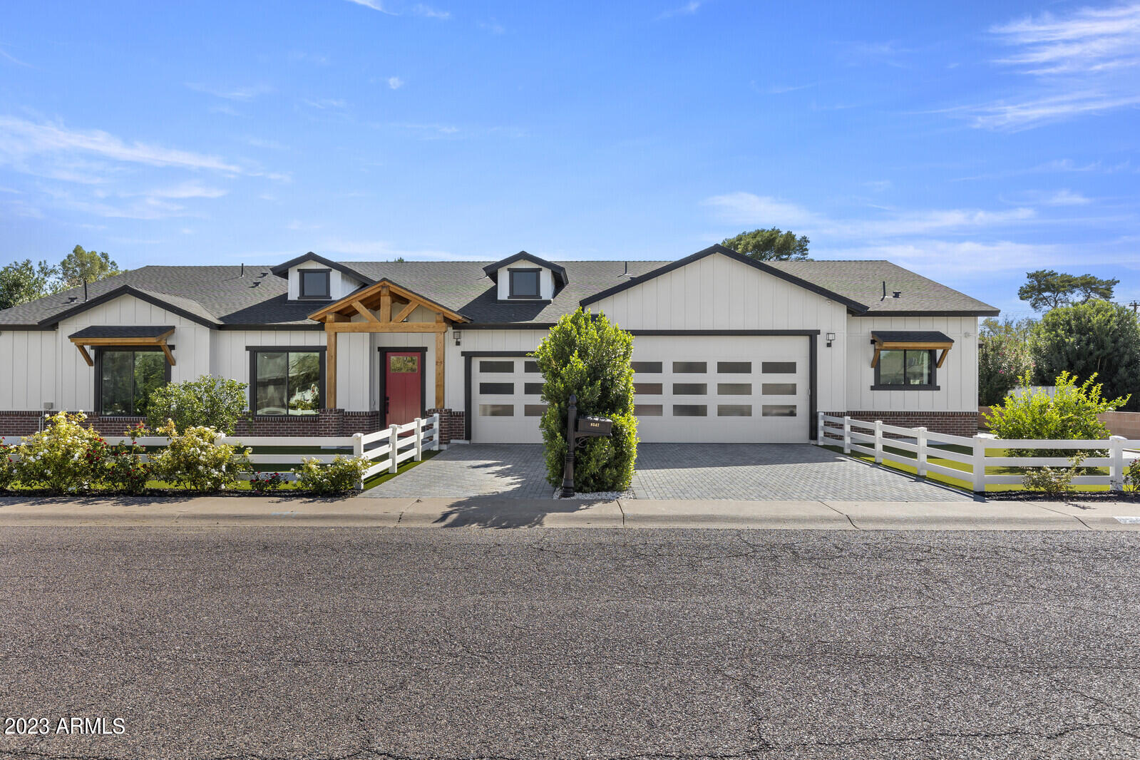 Exquisite New Home w/high end finishes, Smart Technology! Minutes away from Old Town Scottsdale.  Niche area-1/2 acre lot & NO HOA.   Built to be their Forever Home the breathtaking attention to detail is unsurpassed.  14' Ceilings & Glass walls encompassing the covered patio & facing the massive back flood irrigated lawn is complete with a Pickle Ball Court!  Acoustic wall paper, central vac, state of the art Automation/Security/Audio including 88 speakers and 19 cameras, Hydraulic auto TV mounts & motorized blinds. Waterfall counters.  Electric car charging station. Attached 2/2 Guest Quarters with private entrance, kitchen, laundry & garage.  Property boasts lemon, orange, lime, grapefruit and tangelo trees.  Serene, secluded silence at this location..Your Dream Home is waiting for you