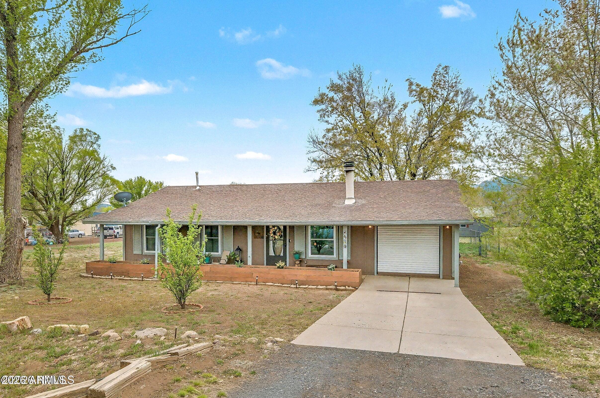 Upgraded with VIEWS! Welcome to this beautifully maintained home in the desirable neighborhood of Fernwood, offering incredible mountain views and a peaceful, tree-lined setting. Situated on a spacious lot, this property provides the perfect balance of privacy and Northern Arizona charm. Inside, you'll find a warm and inviting layout with abundant natural light and thoughtful updates throughout. The kitchen features stainless steel appliances, ample cabinetry, and generous counter space. Additional features include an attached garage, ample parking, and easy access to town while still enjoying a quiet, rural feel. Enjoy nearby forest access and proximity to the ''cinders'' Room to breathe--whether it's for animals, gardening, or simply enjoying the wide-open surroundings.