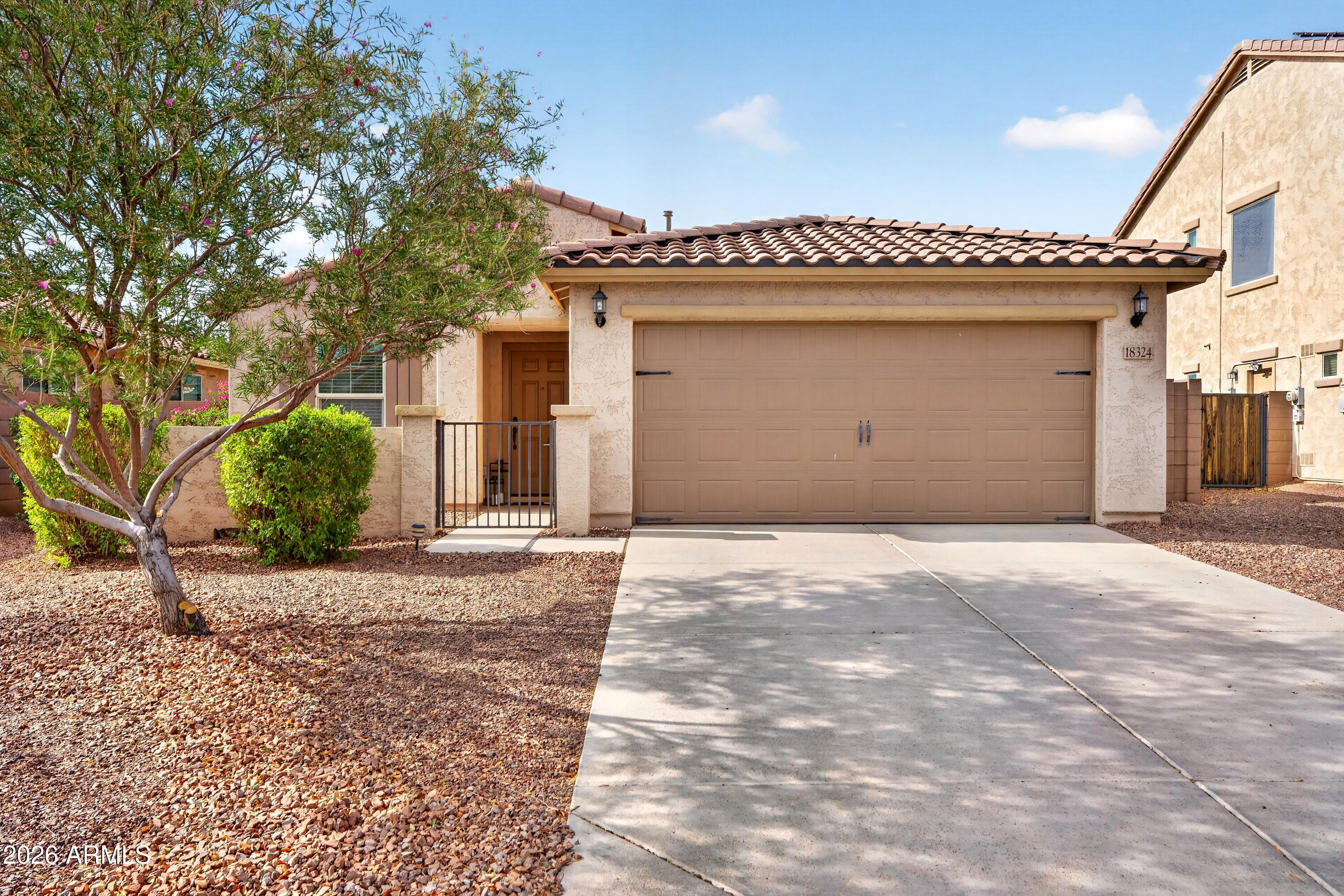 Welcome to this beautifully maintained, **move-in ready single-story home in Goodyear, Arizona**, offering 4 bedrooms, 2 bathrooms, and a thoughtfully designed open-concept floor plan that perfectly blends comfort, style, and functionality. From the inviting curb appeal with low-maintenance desert landscaping to the spacious two-car garage, this home is ready to impress.

Step inside to vaulted ceilings, abundant natural light, and a spacious living area that flows seamlessly into the kitchen and dining, making it ideal for both everyday living and entertaining. The beautifully appointed kitchen features timeless white cabinetry, elegant quartz countertops, stainless steel appliances, a large pantry, breakfast bar, and a dedicated breakfast nook. 
The private primary suite offers a peaceful retreat with a spacious en-suite bathroom featuring a dual-sink vanity and a walk-in closet. Three additional bedrooms provide flexibility for family, guests, a home office, or hobby space.

Step outside to a finished backyard designed for easy Arizona living. Enjoy low-maintenance desert landscaping, attractive paver accents, and a covered patio that creates the perfect space for relaxing, entertaining, or enjoying your morning coffee year-round.

Residents enjoy community walking and biking paths, greenbelts, and a neighborhood playground, creating opportunities to stay active and enjoy the neighborhood.

Located in Goodyear, AZ, this home offers convenient access to Loop 303, I-10, Luke Air Force Base, United Aviate Academy, Goodyear Ballpark, shopping, dining, golf courses, parks, and the rapidly expanding West Valley employment corridor. Whether you're a first-time homebuyer, relocating to Arizona, or simply searching for a move-in ready home in one of the Phoenix area's fastest-growing communities, this exceptional property offers the perfect combination of location, lifestyle, and value.

Don't miss your opportunity to own this beautiful home in one of Goodyear's most desirable and rapidly growing communities!