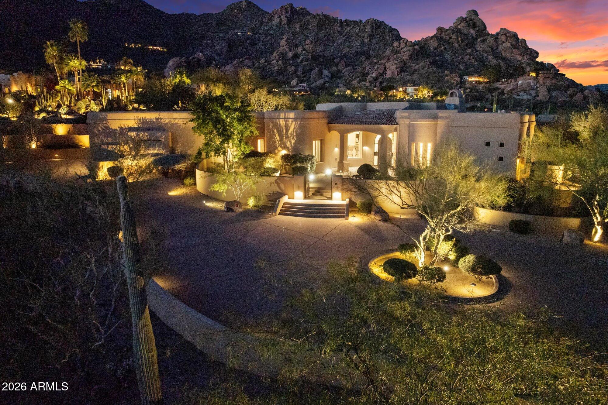 Luxurious 4,894 sq ft single-level custom home with no interior steps features 4 Bedrooms and 4.5 baths, perfectly positioned on a private 1.8-ac hillside lot on the south side of Black Mountain in an exclusive gated community. Designed for exceptional entertaining, this residence offers a spacious great room, walls of windows, a dramatic circular wet bar, and an open gourmet kitchen--all seamlessly flowing to the resort-style backyard. Enjoy an infinity-edge pool & built-in spa overlooking striking boulder outcroppings, with stunning city lights, sunset views, and sweeping mountain vistas. Three gas fireplaces add warmth and ambiance. Outdoor living complete with a built-in BBQ grill and bar. A circular driveway leads to the oversized 1555 sf garage, incl a 36' deep RV garage. See doc tab