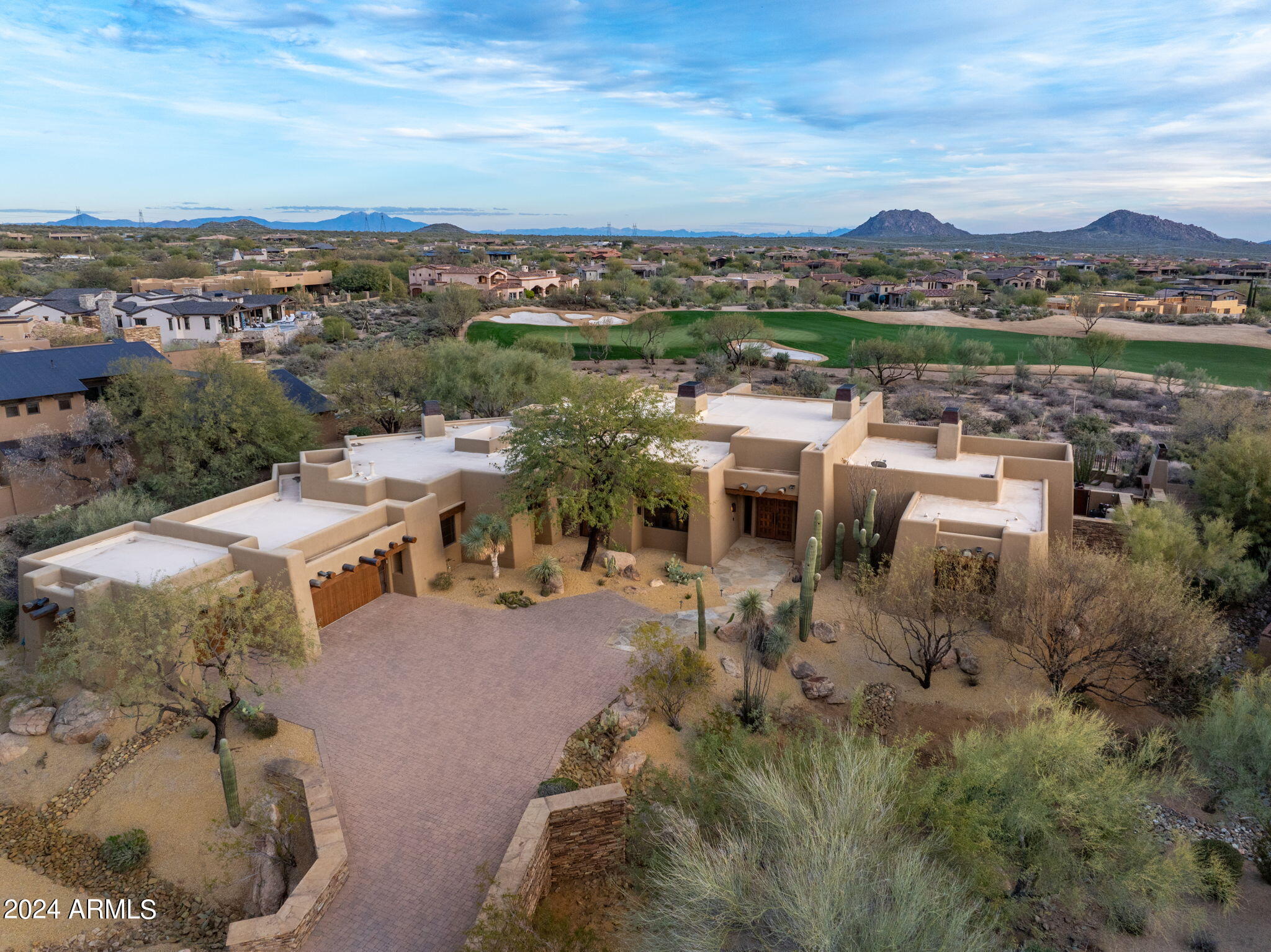 FULL GOLF MEMEBERSHIP COULD BE AVAILABLE FOR THE RIGHT OFFER SUBJECT TO THE MIRABEL CLUB BYLAWS. One of the most iconic homes in the Mirabel Club. Designed by Terry Kilbane this southwest pueblo style home has traditional battered exterior walls and the very finest interior finishes. Located on one of the best lots in Mirabel, the elevated south facing backyard has an incredible raised three sided negative edge pool drawing your eyes beyond to the stunning golf course, mountain, city lights and sunset views. Truly a remarkable home and a rare chance to own one of the best of the best at a price well below replacement costs. Some improvements and upgrades include: 3 HVAC units replaced in the last year, roof recoated w/in last 30 days, and new granite countertops in the kitchen