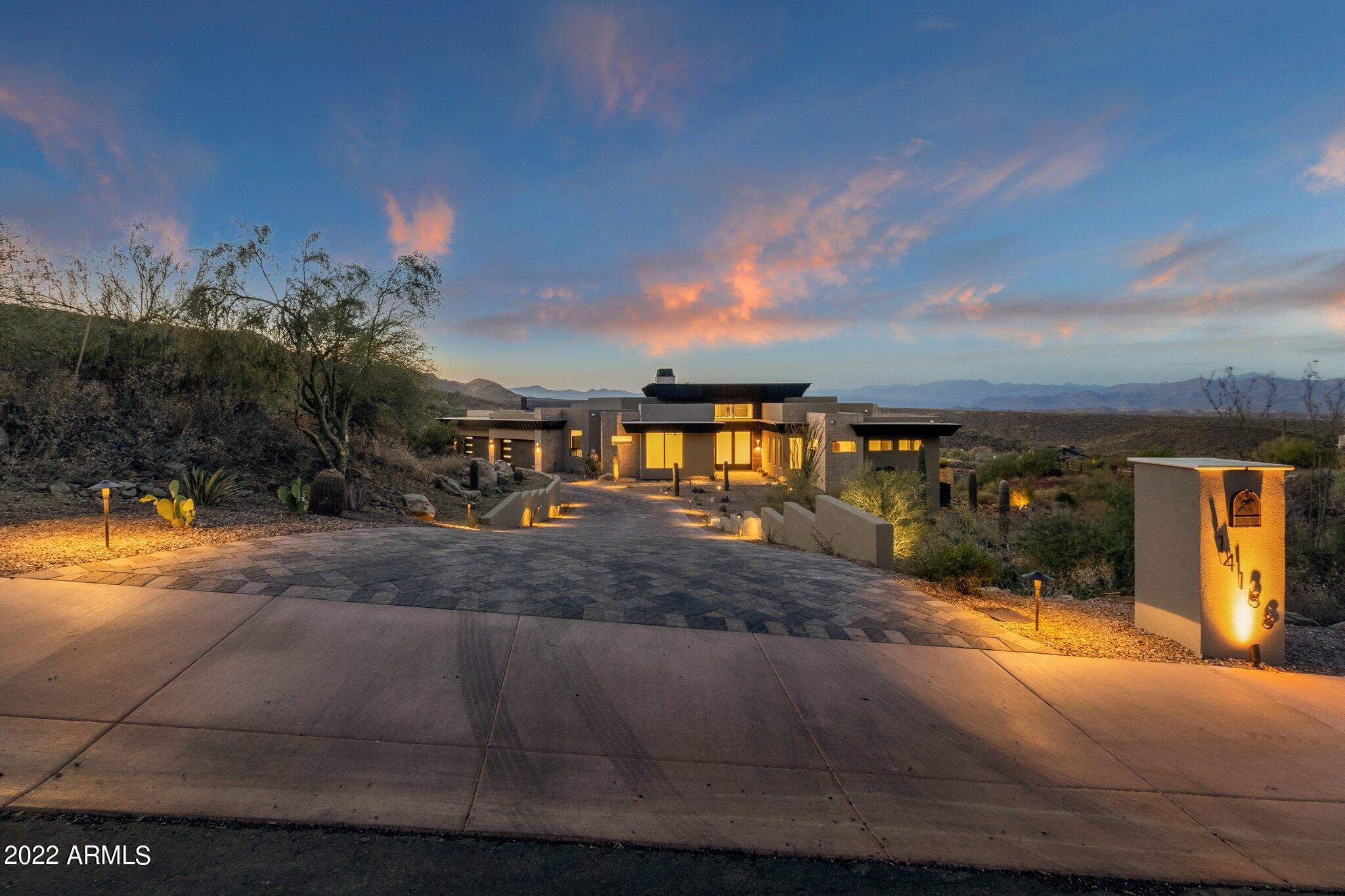 One of the most breathtaking homes available on the market.  This home has forever mountain views through a wall of windows.  every bedroom features a walk in closet, en suite, You won't believe the luxury this home features. From a hidden butler pantry, to a steam shower in the master.  The designer used a mixture of wood in offices and bedrooms to tile throughout the main home. The statement fireplace when you walk in is incredible.