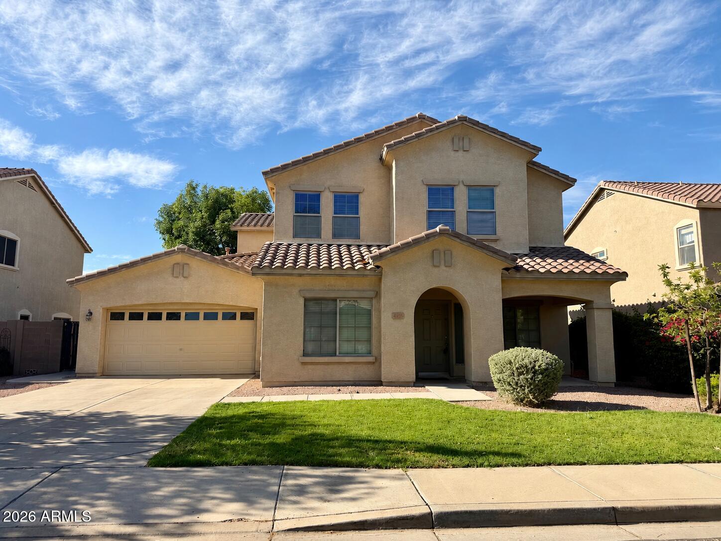 Exceptional Sun Groves home with room for everyone! This impressive 2,988 sq. ft. floor plan features 4 bedrooms, 2.5 baths, and a downstairs den that can easily function as a 5th bedroom or office. The heart of the home is the expansive kitchen boasting a large island, breakfast bar, butler's area, and oversized walk-in pantry, all opening to spacious living areas with soaring ceilings. The generous primary suite offers dual walk-in closets and a spa-like bath with separate tub and shower. Outside, enjoy Arizona living at its best with a covered patio, beautiful waterfall pool, firepit, and built-in seating. This home is a must see!