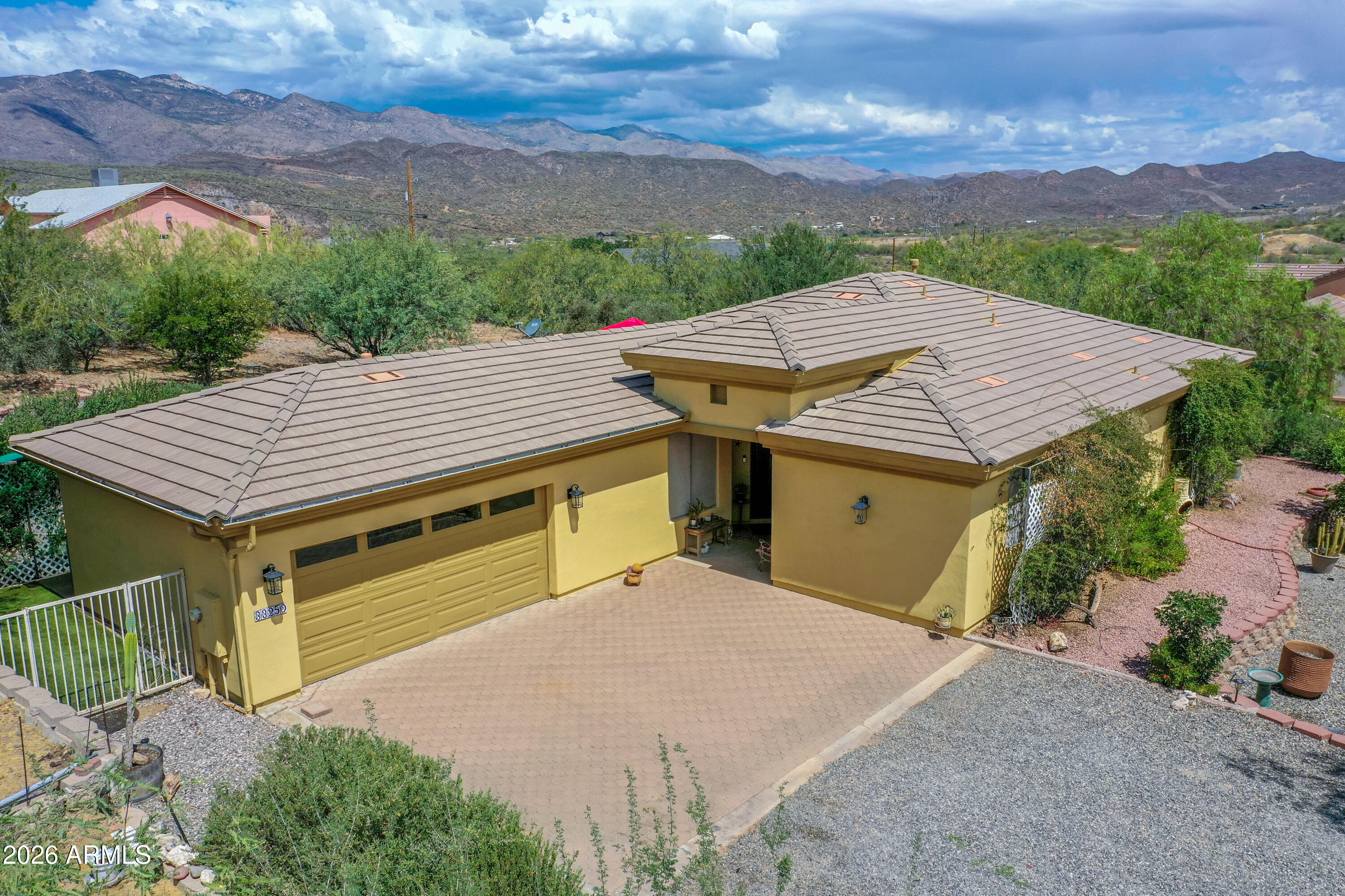 Spacious open floor plan featuring 2 bedrooms and 2 bathrooms with an oversized Great Room.  Originally designed as a 3-bedroom home, there is ample space to easily add a 3rd bedroom or home office. Move-in ready and exceptionally clean with ceramic tile throughout.  Abundant storage throughout the home.  Enjoy the covered patio and beautiful mountain views.  No HOA.  Property is serviced by private water company, propane, and septic.