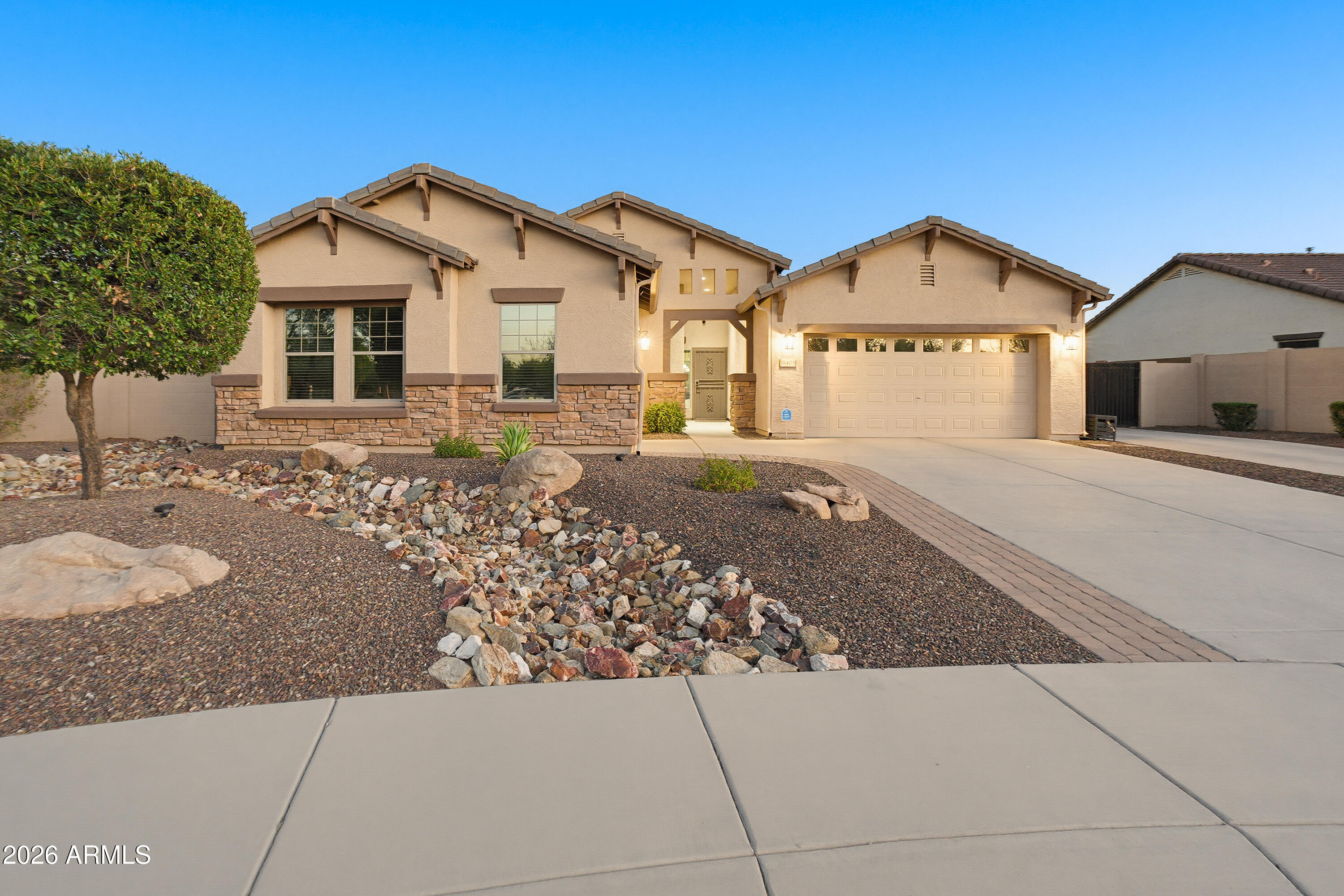 Don't miss this incredible opportunity to own a beautifully upgraded home in one of Litchfield Park's most desirable locations! Perfectly situated on a prime corner cul-de-sac lot with parks, basketball and sand volleyball courts just across the street, this home also offers the rare bonus of HOA-approved RV parking. Inside you'll find 4 bedrooms, 2 updated bathrooms, a 3-car garage, formal living and dining rooms, plus a spacious family room with upgraded carpet and a cozy gas fireplace. The kitchen features rich espresso cabinetry with custom crown molding, granite countertops, and stainless steel appliances. The private primary suite offers direct patio access, while both bathrooms have been beautifully updated with matching espresso cabinetry with custom crown molding, granite countertops, and stainless steel appliances. The private primary suite offers direct patio access, while both bathrooms have been beautifully updated with matching espresso cabinetry and granite countertops. Step outside to your own backyard oasis featuring a resort-style pebble-finish pool and spa with stone accents, water features, in-floor cleaning, and a saltwater system, plus an extended covered patio with pergola, natural gas fire pit, travertine hardscape, lush mature landscaping, artificial turf, LED landscape lighting, and a 14-foot RV gate with concrete pad, 50-amp hookup, and sewer dump.(All furnishings are available on a separate bill of sale)