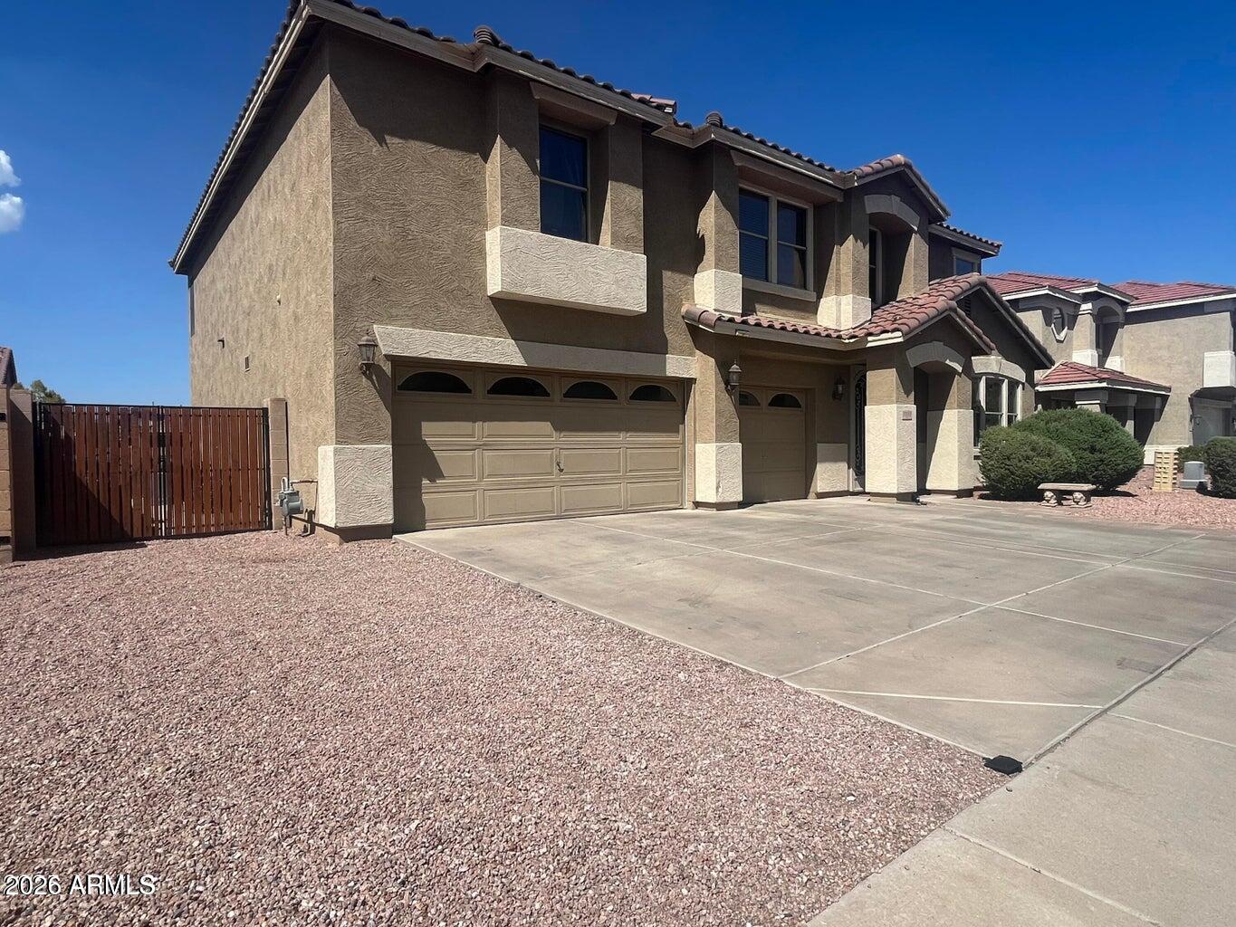 This home is almost 4 thousand sq.ft. and has 5 HUGE Bedrooms, 3 Full Bathrooms, Huge Loft/ Game Rm. This Home sits nice near South Mountian in a Gated Community with ample space.  Minutes from downtown Phoenix, Light Rail, Shopping Mall, Centers, & Freeway.  Enjoy the mountain views and hundreds of hiking trails in this beautiful community park.  Beautiful kitchen Features a breakfast bar, granite counters, and stainless steel appliances including a WIFI Fridge.  Master Bedroom big enough to split as a Master and a retreat. Huge Master Walk in Closet with double entry. Mini fridge in Master B.R. is included. 3 Car Grg. for all your Toys & Storage. Also connects to myQ app. to open and close your garage door from wherever you are. RV Gate & Backyard has Grass & a nice big covered patio.