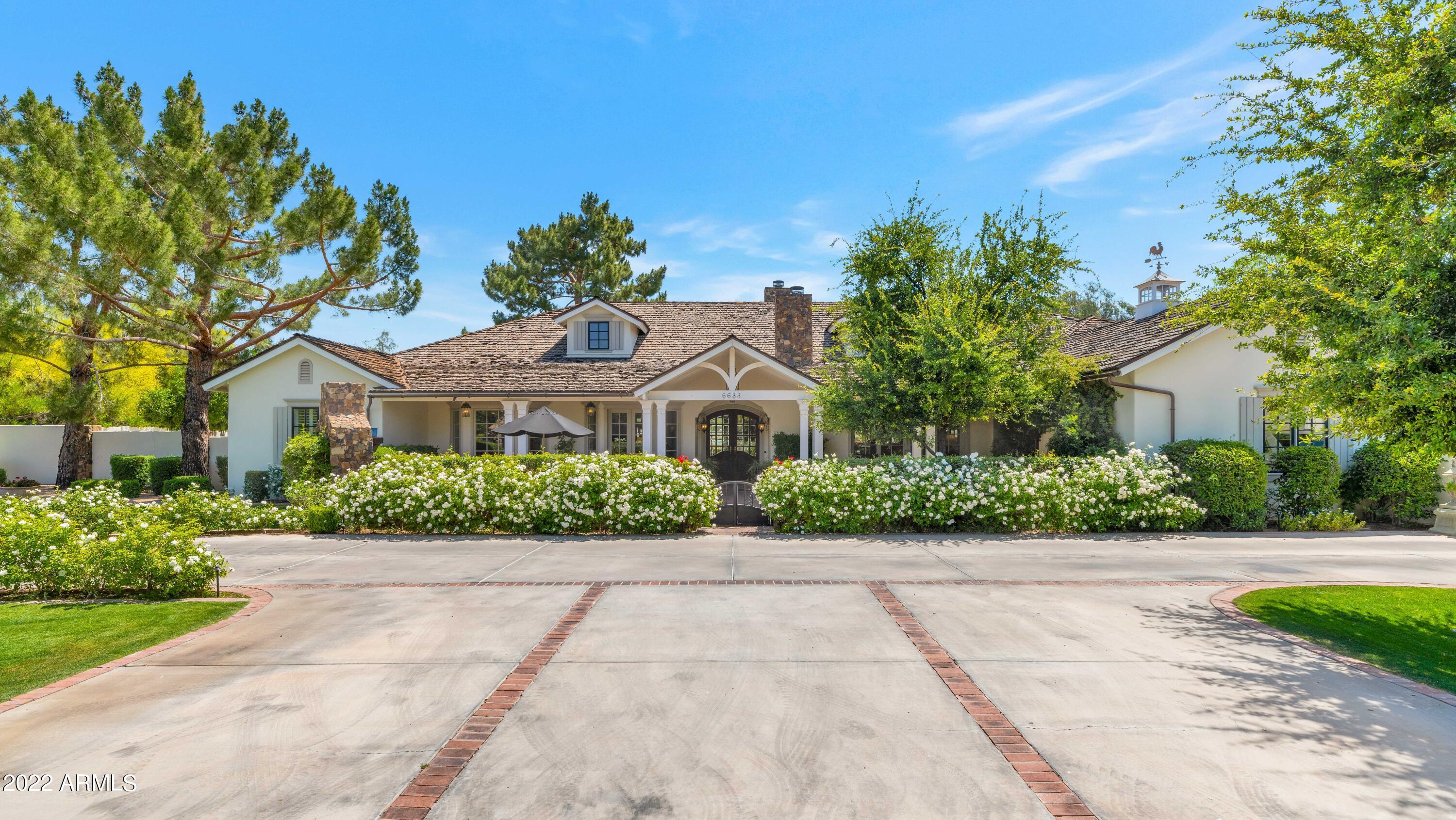 Secluded Exeter Acre in Arcadia Proper.  Home is where the heart is and your heart will melt when you see this rare flagship property!  This charming estate, with split floor plan, is every family's dream come true.
High Ceilings, beautiful light, charming built ins and spectacular floor plan check all the boxes. Children's wing includes 4 en-suite  bedrooms and a bonus playroom while the primary wing includes an office/6th bedroom.  The custom kitchen is open to the heart of the home and looks out over the expansive backyard and patio.  Tucked away down a private drive and filled with high end finishes, this home is ready for the next generation.