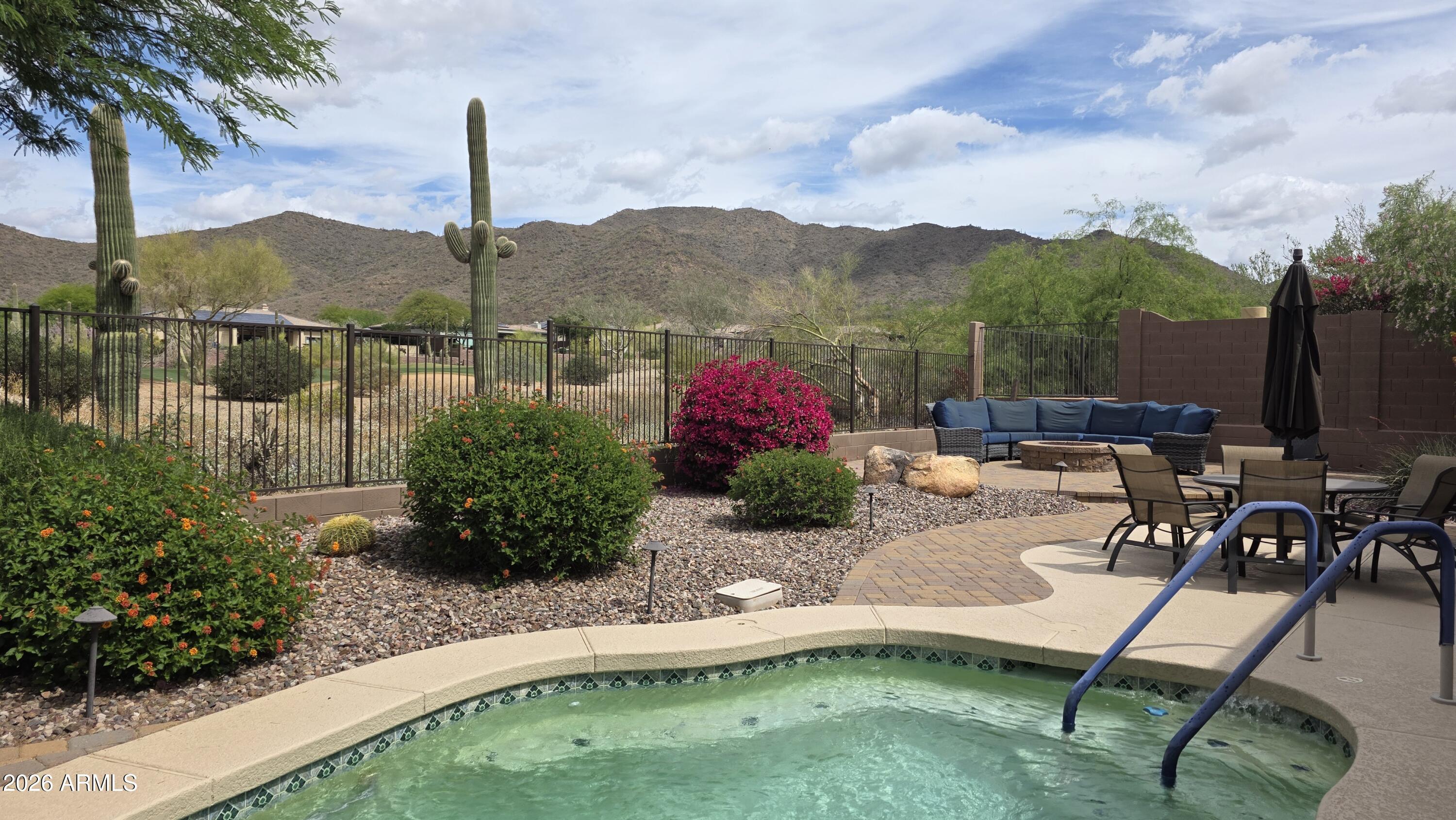Stunning golf-course home in Anthem Country Club with spectacular mountain views. Recently refreshed inside and out (painted 2026) and updated systems including new HVAC. Electricity is expensive, good thing this home has OWNED SOLAR!  The main house also offers a spacious flowing  great room with gas fireplace, formal living and dining rooms, 4  bedrooms and 2.5 baths and central vac. The master bedroom features a huge walk-in closet, 2 separate sink areas and a makeup vanity. The 2nd bedroom also has a walk-in closet.  The entertainer's kitchen features a large island, abundant cabinetry and a new Sub Zero refrigerator. Outdoor living shines with a heated spa/pool (newer pool equipment), gas firepit with raised deck area and expansive vistas of the fairway and mountains. The views are truly spectacular in this North facing resort backyard. Separate casita with its own bedroom and bath round out the backyard! The casita has so many uses: guest house for family visits or a pool house, office space, art studio and more.   This home has beautiful curb appeal with a custom finish driveway, front courtyard and a  3 car garage with cabinets & epoxy flooring. Perfect blend of resort-style amenities in Anthem Country Club and everyday comfort in a premier golf community. You will LOVE going for walks in this community and seeing the beautiful views and wildlife. Tennis, pickleball, swimming, golf, fine dining and more!  There are also many wonderful hiking trails to enjoy the Arizona desert beauty.  Commuting is also easy since the I-17 is just  minutes away.  Don't miss out on this home with it's beautiful views! Come see it ASAP before it's gone.  AMENITIES: Anthem Country Club has TWO golf courses and country clubs.  Fitness centers, tennis and pickleball, swimming pools and spas, fine dining and more. You also can use the amenities in Anthem Parkside which includes a huge water park (with slides!), fitness center, a 63-acre park with playgrounds, skateboard park, ballparks, sand volleyball, picnic  areas and even a choo choo train! Anthem has many wonderful community events like fireworks, holiday celebrations, farmers markets and more. They even host fantasic triathalons!  Anthem truly has something for everyone.