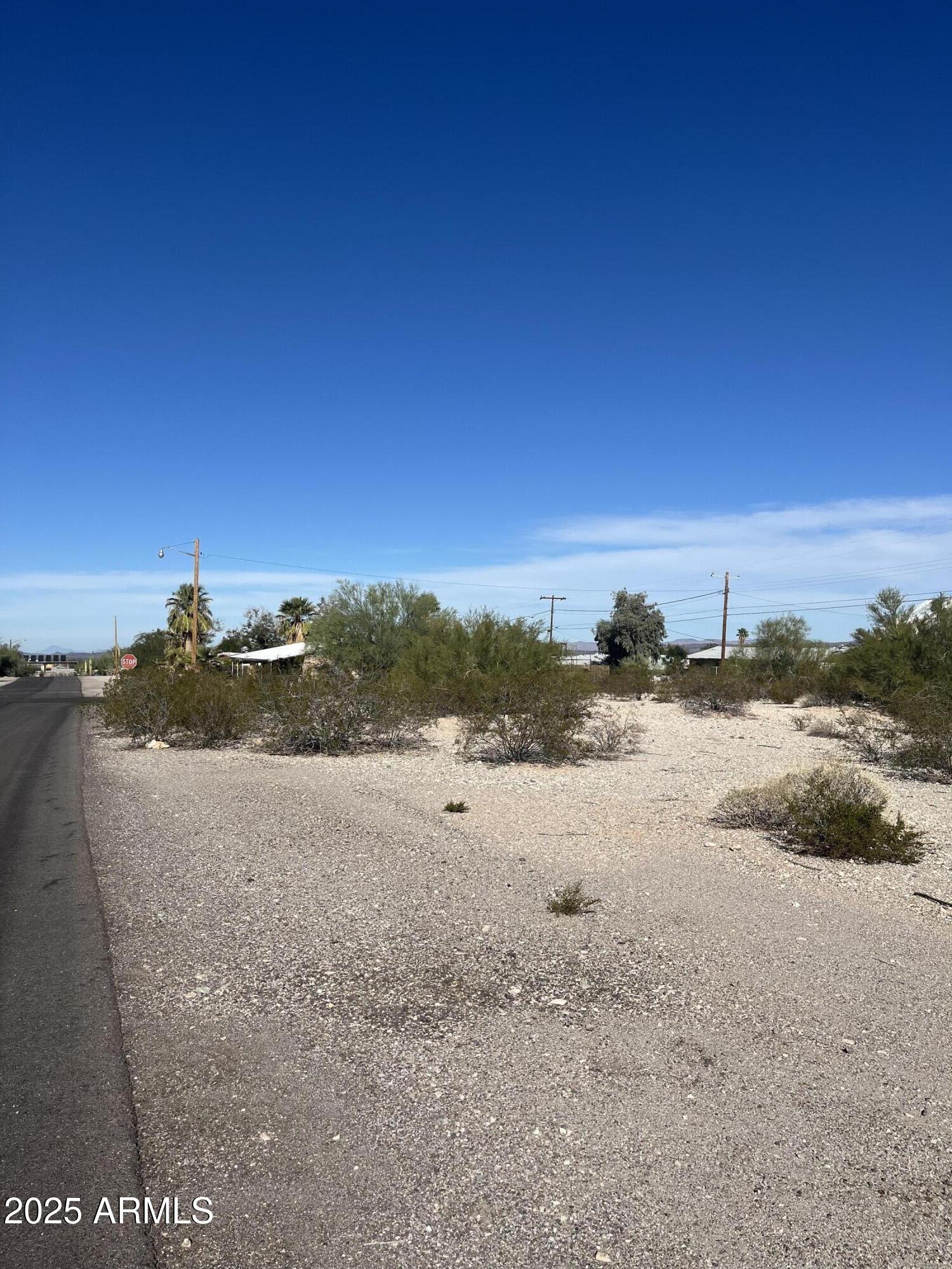 Spacious corner lot located at the intersection of Center Street and Sartillion Avenue in Ajo. This property offers excellent potential for building your custom desert home.
- Lot Features: Large corner parcel with easy access
- Utilities: Water and electric nearby
- Septic: Buyer to install septic system
- Location: Conveniently situated within town, surrounded by desert views
Bring your vision and create your own desert oasis on this well‑positioned lot.