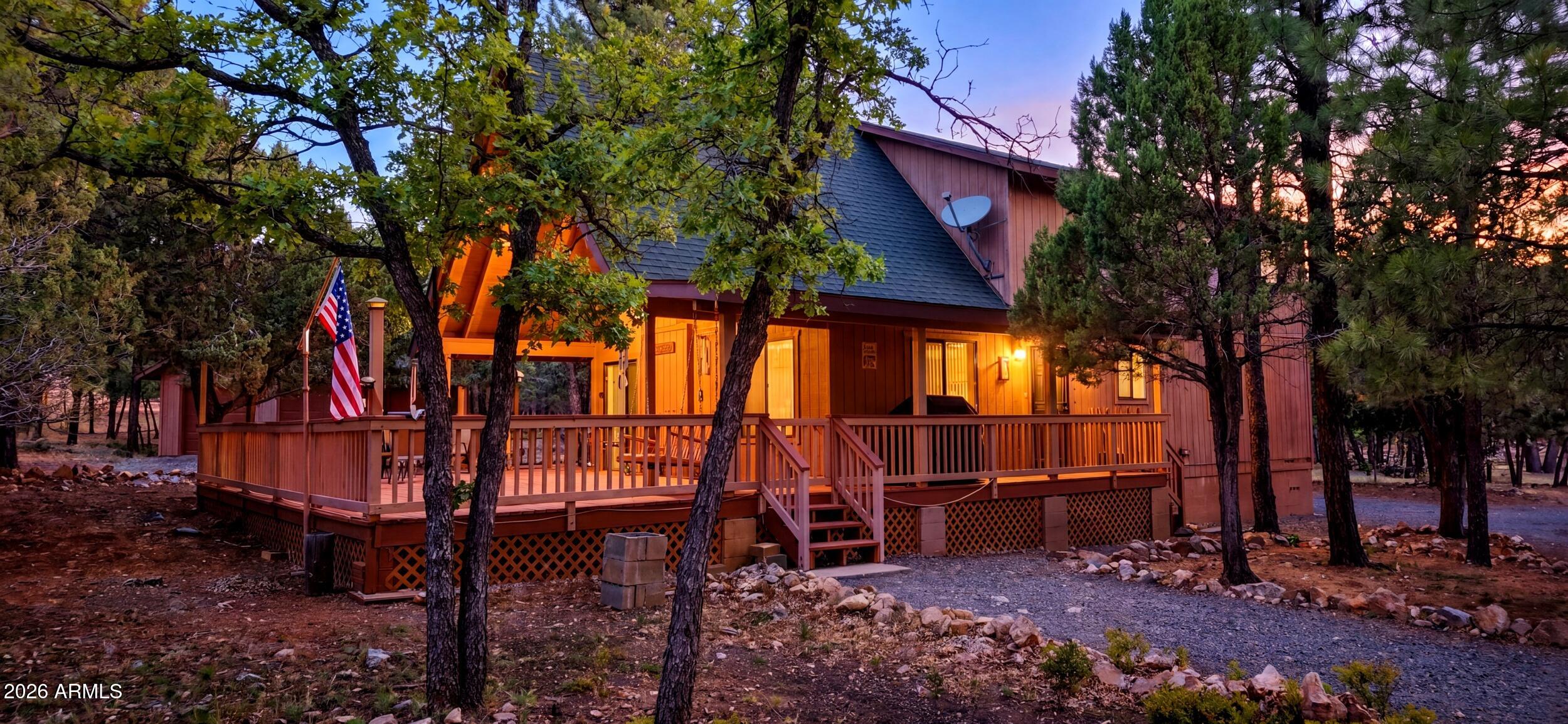Come see this nice sized 3 bedroom/ 2 bath chalet style cabinet.  Downstairs offers an open living area , 2 guest bedrooms, and a guest bathroom (one bedroom has a jack n jill access to bath) , gas fireplace and wood stove.  Go upstairs to the master bedroom and bath as well as a large sitting room (office, addl sleeping area).  The lot offers several mature trees with a mixture of juniper, pine and oak. Detached garage, with room for your toys and vehicle.  Sit on the great open deck and watch the wildlife saunter by while you enjoy your morning coffee.  Come see your full time home or weekend escape.
