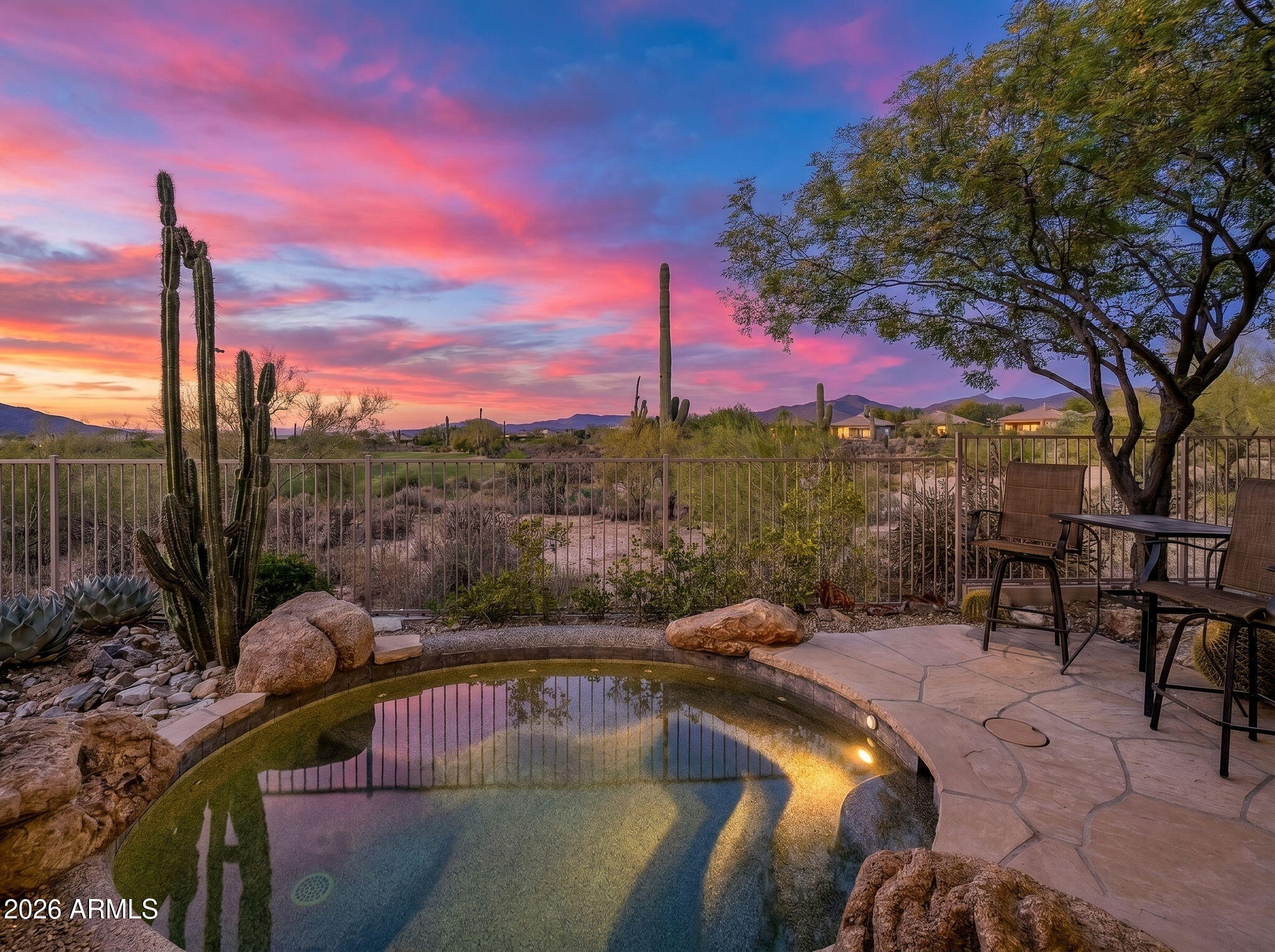 Gracefully elevated and thoughtfully set back from the golf course, this exceptional residence offers a rare blend of privacy, elegance, and refined desert living. The home features three generously appointed bedrooms, three baths, and a sophisticated study adorned with custom built-in cabinetry and rich hardwood flooring.

Designed for both comfort and effortless entertaining, the open-concept great room is defined by soaring 12-foot ceilings, expansive walls of glass, and an abundance of natural light that seamlessly connects indoor and outdoor living. The interiors flow to a beautifully crafted flagstone patio with a spool, where sweeping golf course, mountain, and sunset views create a truly breathtaking backdrop. The coveted northwest exposure ensures soft, all-day light and inviting outdoor enjoyment.

Meticulously maintained by its current owners, this residence reflects pride of ownership at every turn and presents in impeccable, move-in-ready condition. Recent enhancements include upgraded vinyl flooring in the living areas and primary suite, as well as a newer water heater and garbage disposal, ensuring both style and peace of mind.

An exceptional opportunity to own a private retreat in one of Scottsdale's most desirable golf communities.