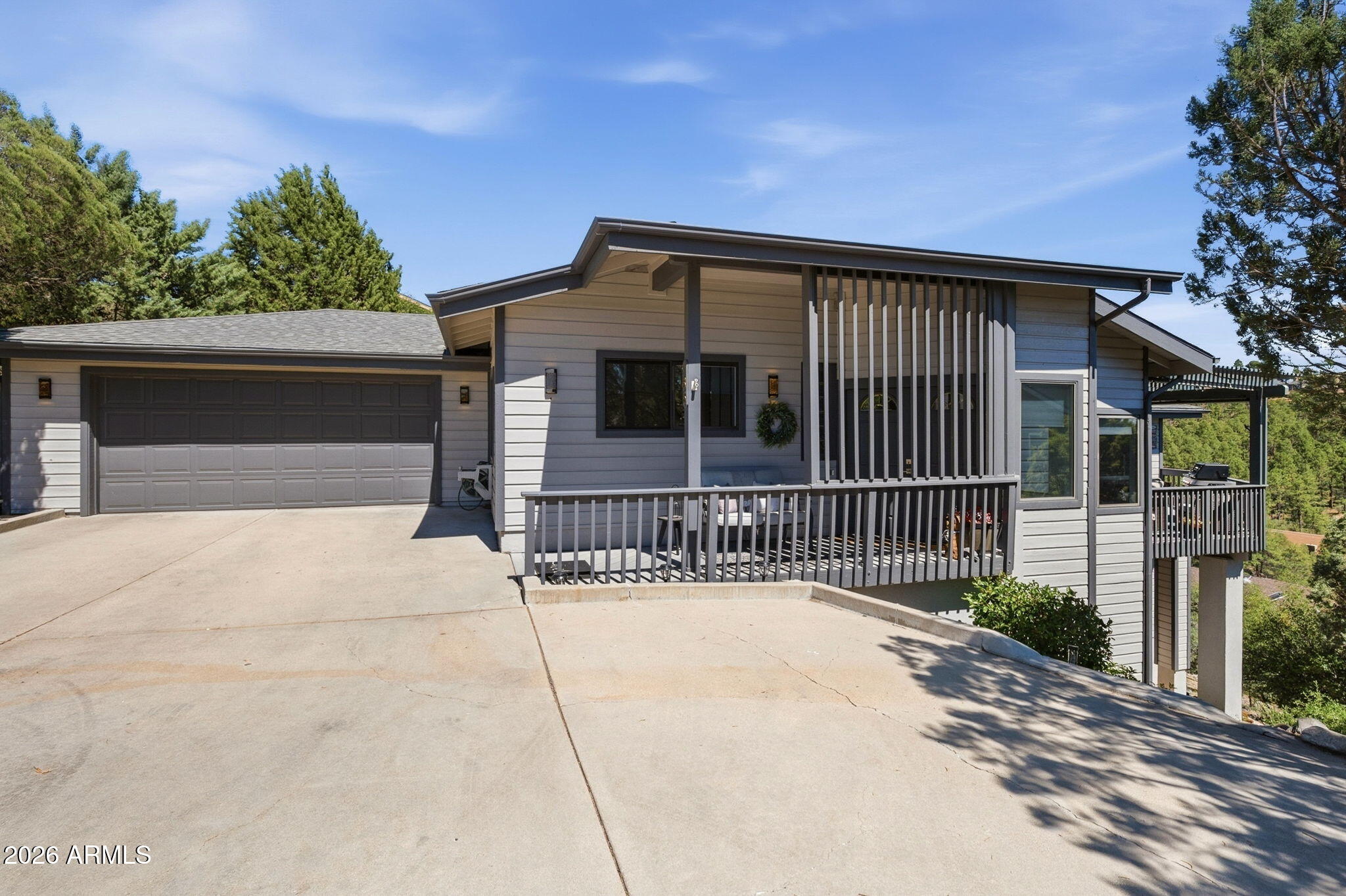 Tucked among the cool pines of Hidden Valley Ranch, this spacious 3-bedroom, 3-bath home offers mountain views, privacy, and the peaceful Prescott lifestyle buyers are looking for. With 3,137 square feet, the home features wood flooring, high ceilings, a dramatic great room with fireplace, sunken living room, office nook, updated kitchen appliances, painted cabinetry, and refreshed baths. The walkout lower level includes a private bedroom, full bath, and large family room or den. Enjoy wildlife, natural landscaping, and quiet surroundings from the deck, all just minutes from downtown Prescott. Community amenities include a clubhouse, pool, tennis, pickleball, racquetball, trails, and RV storage.