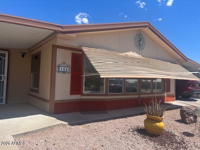 FREE LOT RENT for 2 MO. Move right in to Pueblo Manor, a sought after 55+ community. This well designed double wide 2BR 2BA home has an open floorplan, freshly painted and partially furnished. Your great room is very bright with new window blinds, vaulted ceilings, a built-in buffet/hutch & a ceiling fan. Your galley kitchen has a smooth top electric range with a new range hood and a breakfast bar. Some other new items include new light fixtures,new toilets and new screen doors. If you are looking for storage, you found the right home! The huge screened in AZ room is waiting just for you. There's privacy in the backyard with a mountain view and block fence. Get involved at the clubhouse where you can join in games, pickleball or just relax by the pool, It's agreat lifestyle & move-in ready
