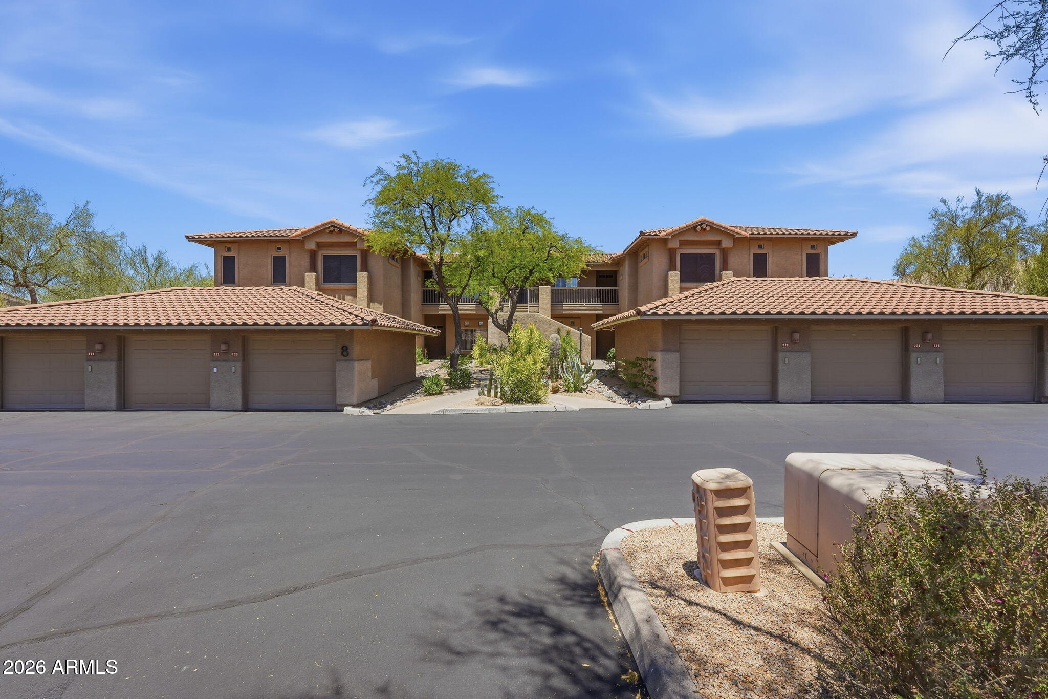 Boutique complex (48 total units) in upscale North Scottsdale, featuring beautifully manicured grounds, community pool & spa, fire pit, and a shaded pool-side BBQ. This Mirage Village ground-floor (no stairs) condo offers a lock-and-leave lifestyle with 2 primary suites in a split layout, a detached garage, a covered patio, all steps away from the resort-style pool. Additional features: 9 foot ceilings, maple cabinets, tiled kitchen and baths; walk-in closets; breakfast bar counter; entertainment nook; inside laundry; recently replaced HVAC and hot water heater (approx 2 years). Quiet desert views with great access to North Scottsdale's premier dining, shopping, golf courses, and hiking trails. Property ready for your buyers personal touches. Easy to show!