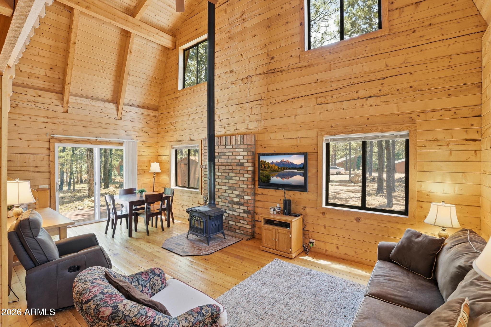 Tucked away on the quiet loop of Mineral Drive, surrounded by stunning multi-million dollar cabins and towering ponderosa pines, this true log cabin is the kind of place people dream about when they imagine escaping to Forest Lakes. From the moment you arrive, the cabin vibes are undeniable...warm wood tones, the scent of pine in the air, and that cozy feeling that instantly makes you want to slow down & stay awhile. The covered front deck invites lazy mornings with coffee while the rear open deck is perfect for cool summer evenings under the stars. Inside, the cabin lives just right..a welcoming family room centered around a wood-burning stove, a charming kitchen, bathroom, & French doors leading into the main bedroom. Upstairs, the spacious sleeping loft offers additional room for guests game nights, or peaceful afternoons listening to the wind through the trees. This is the perfect weekend getaway..large enough to enjoy comfortably, yet small enough that you won't spend your weekends cleaning and maintaining. A storage shed onsite provides extra room for your mountain gear and outdoor essentials.

If you've been searching for the epitome of cabin living in Forest Lakes, this is it. Professional photos and showings are expected to begin in the coming weeks... and this hidden gem is absolutely worth the wait.