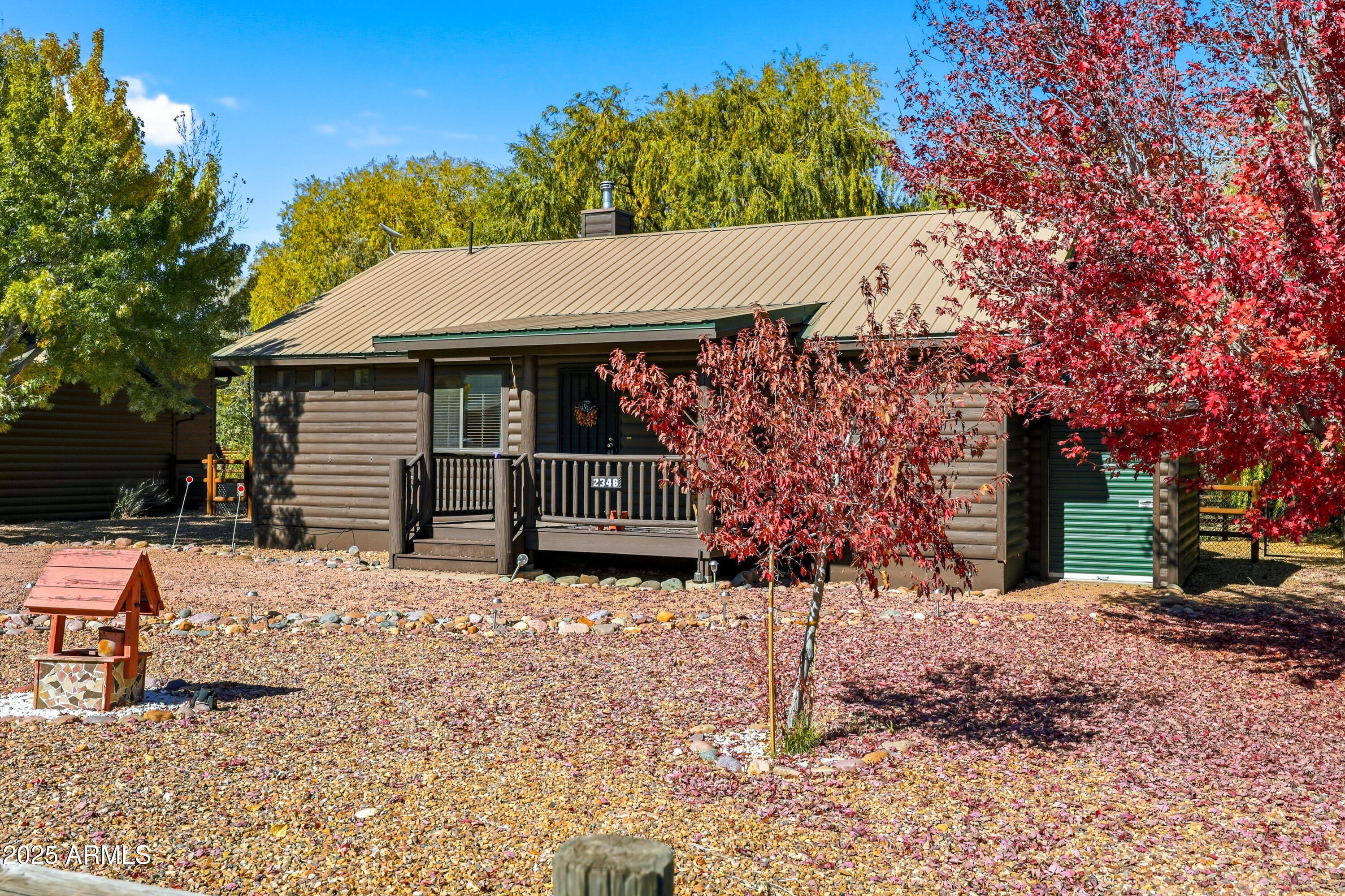 Nestled in the cool pines of Overgaard, AZ, this charming 2-bedroom, 2-bathroom split log-sided Elk model cabin offers the perfect blend of rustic character and modern comfort. The inviting great room features a striking stone-faced fireplace, central heat and air conditioning, vaulted T&G ceiling, and ceiling fans for year-round comfort. The spacious kitchen and convenient laundry room add practicality to the cozy mountain retreat. Step outside and enjoy the tranquil setting with a quaint stream running along the back of the property, shaded by beautiful mature willow trees--an ideal backdrop for relaxation and outdoor gatherings. Located in the desirable Bison Ranch community, this cabin provides the perfect mountain escape while still offering all the comforts of home.