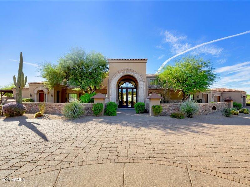 Over 4 acres of sprawling landscape surrounded by 180 degree views of sunsets and city lights! Beautiful, custom built estate in North Scottsdale with extraordinary views! Located in an exclusive gated community, this luxury property features over 10,000 square feet of opulent living and lifestyle benefits that cater to the most active of residents who are looking for a home large enough to entertain but within their own private retreat. Attached, updated guest house, children's wing with flex room, bar and game room area with theater, and outdoor amenities for entertaining! Freshly updated Gourmet Chef's kitchen with wine rack feature and spacious living rooms, multiple exits to the expansive outdoor patios, decks, and balconies. Crest