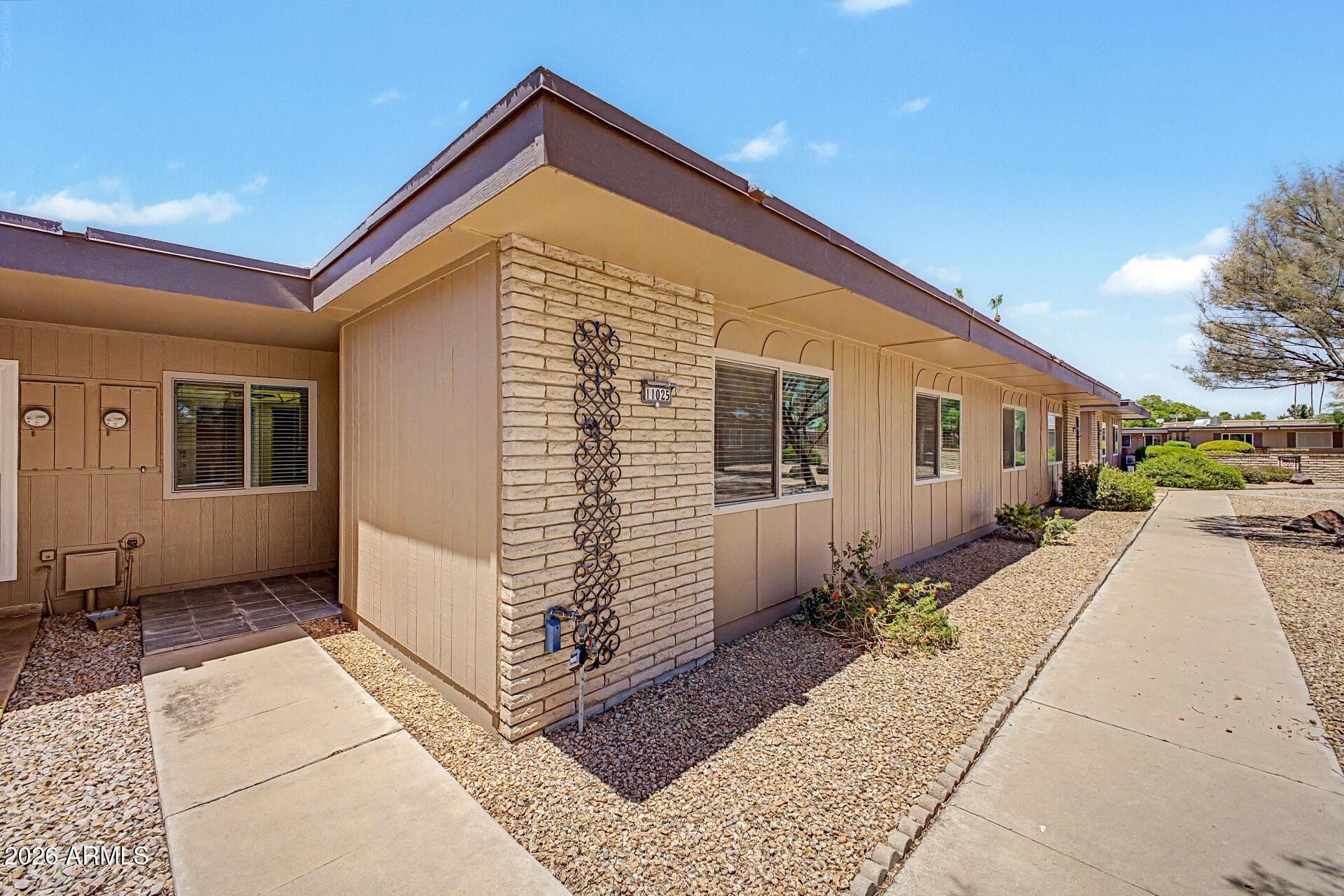 Welcome to this well-maintained 2 bed, 2 bath home offering 1,207 sq ft in the desirable Sun City 55+ community. The bright, functional layout features tile flooring throughout the main living areas, with newer carpet providing comfort in both bedrooms. Enjoy a spacious, enclosed Arizona room, perfect for relaxing, hobbies, or entertaining year-round. The oversized garage includes ample storage cabinets, adding convenience and practicality, with room for a vehicle and golf cart. With low-maintenance living and access to Sun City's golf, pools, clubs, and recreation centers, this home is ready for you to enjoy an active Arizona lifestyle!