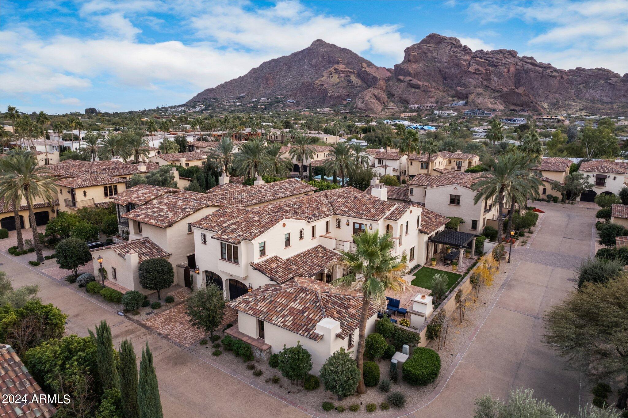 Exclusive sneak peek at this stunning Villa, one of only 34, located in the 24-hour guard gated community at Omni Montelucia Resort & Spa. This 5 bed, 5 ½ bath, 4757 sq ft European-styled home is located on a coveted interior, corner lot. 

The Primary suite is located on the first level and features dual walk-in closets, fireplace and a spa like bath with steam shower & tub. For your entertaining there are three guest ensuite bedrooms, plus a detached ensuite guest casita. 

Enjoy the large private courtyard complete with gourmet grilling station, dining patio, fireplace, bubbling fountain and breathtaking views of Camelback and Mummy Mountain! Villa owners are treated with top-notch service by the 5-star resort staff plus receive a 20% discount on all dining, rooms, spa services, private pool cabana rentals, and more. With Paradise Valley at your doorstep you can hike the Camelback Mountain trails, explore charming art galleries, or tee off at world-renowned golf courses - all just minutes away. Luxury Living awaits!