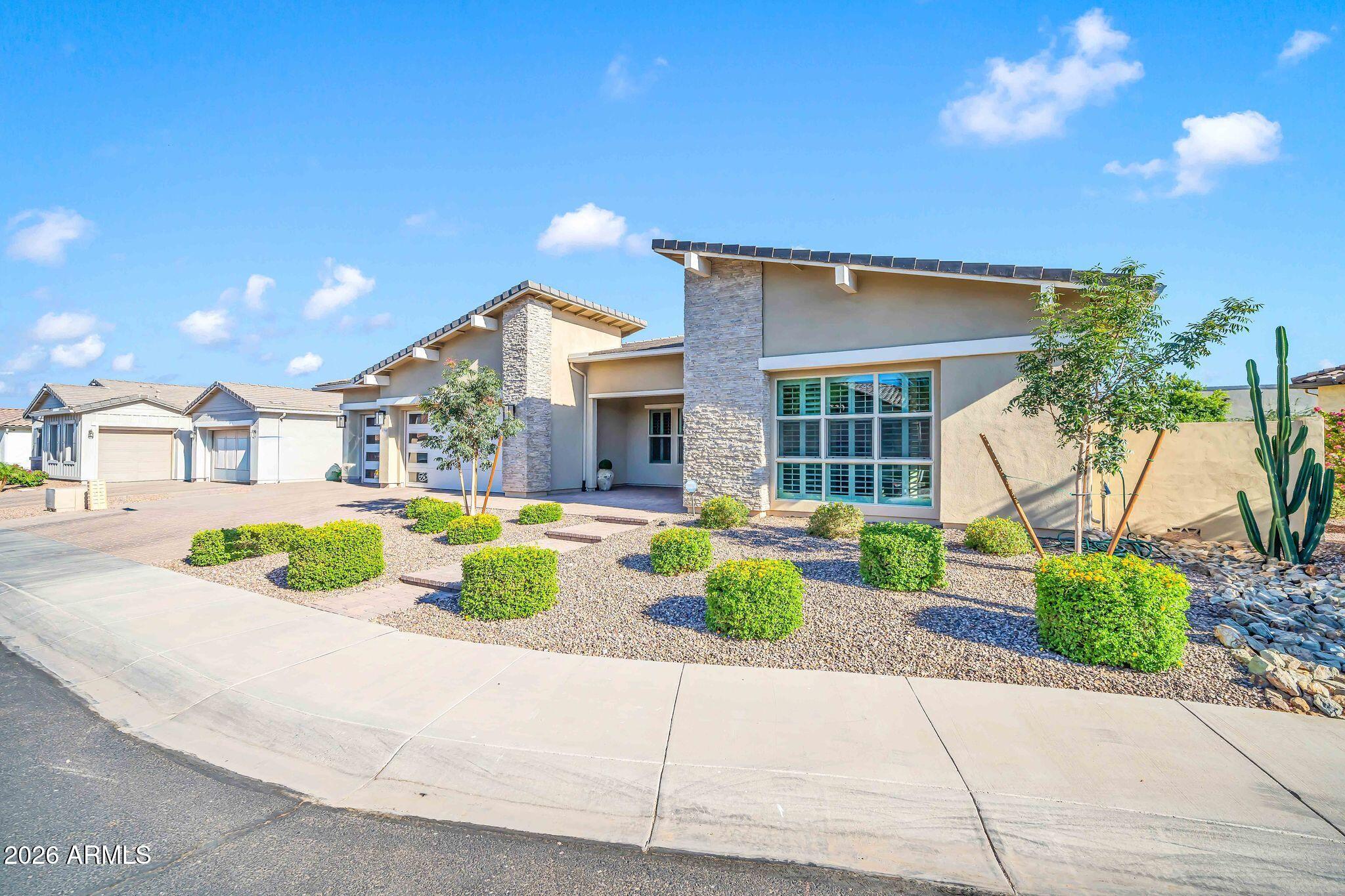 Welcome home to the coveted gated enclave of La Loma at Sunset Terrace in Litchfield Park! This stunning modern ranch delivers the space, style, and privacy today's buyers dream of. The main residence offers 4 generously sized bedrooms, including a primary suite that will stop you in your tracks, featuring a spa-inspired bath with a luxurious soaking tub and a massive walk-in closet. The true showstopper! A sizable Casita with its own private entrance, complete with a full kitchen, living area, bedroom, & bathroom, perfect for multigenerational living, guests, or income potential. Step outside to your personal resort: an expansive covered patio flows to a sparkling diving pool framed by gorgeous travertine, while the pergola with built-in BBQ and sitting area sets the stage for unforgettable Arizona evenings. An RV gate and the lot's private, tucked-away feel complete the package. Homes like this in La Loma rarely come available--schedule your private showing today!