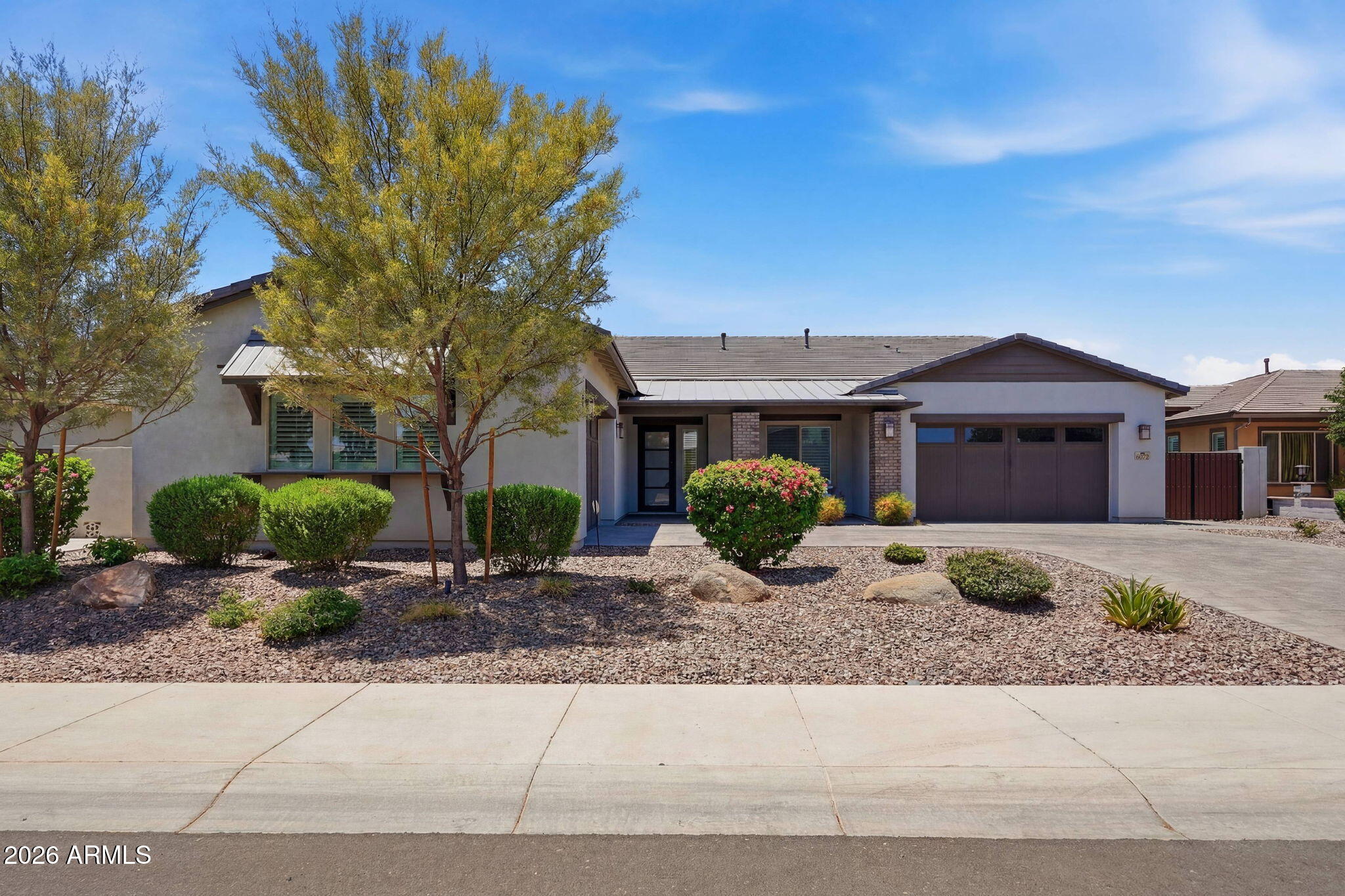 Welcome to Waterston! Gilberts newest premier community! Community amenities include 2 resort style pools, numerous parks, lakes, community functions and more.. Home is a 4 bedroom, 3.5 bath open concept home, with a 5 CAR GARAGE! Home sits on a premium lot with a walking path behind for added privacy. Home features a split floor plan, spacious great room, formal dining, and office or flex area. Gourmet kitchen has a massive quartz island, stainless steel gas cook top, double ovens, microwave and refrigerator. Kitchen also features a walk in pantry and extended buffet into the dining area. Perfect for entertaining! Primary suite is oversized with double closets, large primary bath with his and hers sinks, walk in tiled shower and soaking tub. Secondary bedrooms are separated with a Jack N Jill bathroom. The Brighton floorplan also has an ENSUITE. Bigger then most! This has a walk in closet and full bath. Perfect for Multi generational living! Backyard is low maintenance with turf, covered patio, pergola, built in BBQ and firepit! Waterston is located in the CHANDLER SCHOOL DISTRICT and minutes from GILBERT CHRISTIAN School. Close to SANTAN VILLAGE MALL and 202 FREEWAY. You will have many options for shopping, dining, and entertainment. This is a spectacular home you don't want to miss!