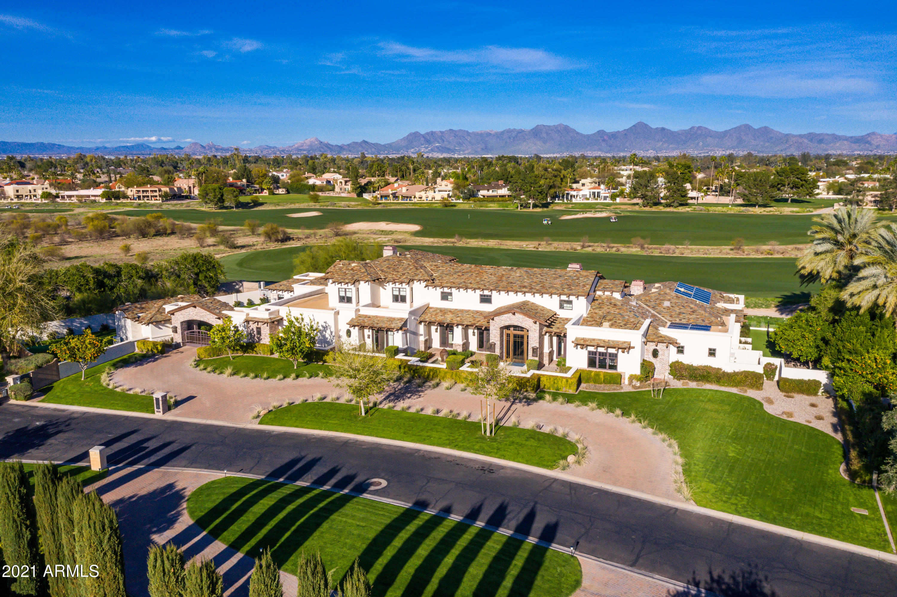 Completely remodeled 2017/18 1.23 Acres located in the heart of Paradise Valley. Exclusive gated community of only 17 homes offers privacy, mountain views and golf course views. Soaring ceilings with trussed beams, wide open floor plan to entertain in, and a backyard overlooking the 9th Fairway of Ambiente Golf Course are just a few amenities of this stunner. Owned solar, Lutron lighting and Control 4 smart home. Main house has 5 bedrooms/ 8 bathrooms, wine area, yoga room & theater/flex area. Separate guest casita is very roomy with full kitchen, bedroom and large bathroom including stackable w/d. Gated motorcourt with 3 garage spaces as well as separate 1 car climate controlled garage and large side play yard round out this beautiful estate