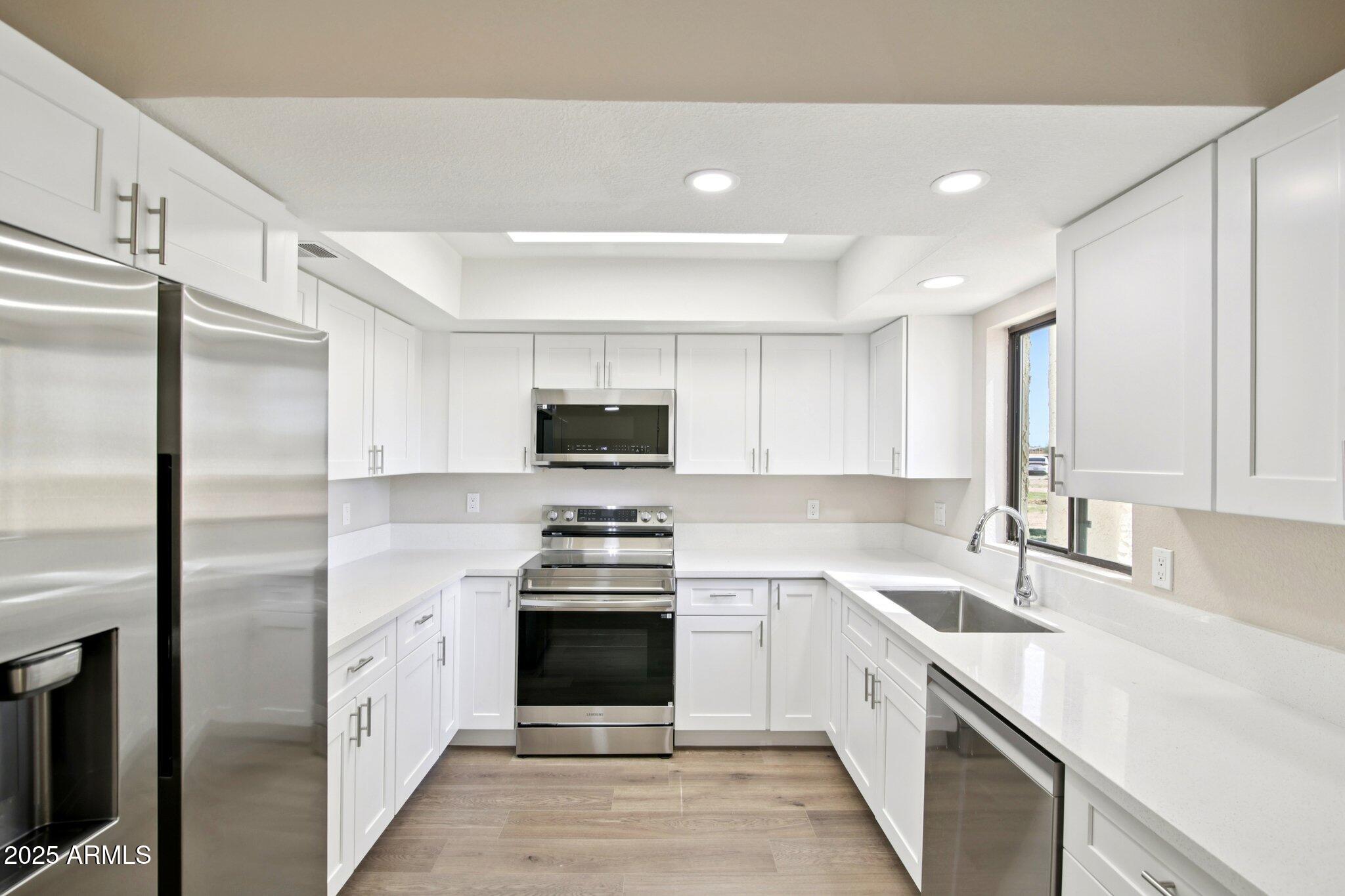 Discover this beautifully updated 2-bedroom, 2-bath townhome in Arizona City's desirable First Tee Villas community. This 1,104 sq ft home showcases modern finishes throughout and offers direct access to the adjacent Arizona City Golf Course--ideal for both active lifestyles and relaxed living. The light-filled open layout flows easily from living space to outdoor patio, perfect for entertaining or unwinding. Residents enjoy premium community amenities including a fitness center, spa, pool, and an on-site restaurant, all just steps away. Conveniently located between Phoenix and Tucson with easy freeway access, this lock-and-leave home is great for full-time living or a low-maintenance seasonal getaway.