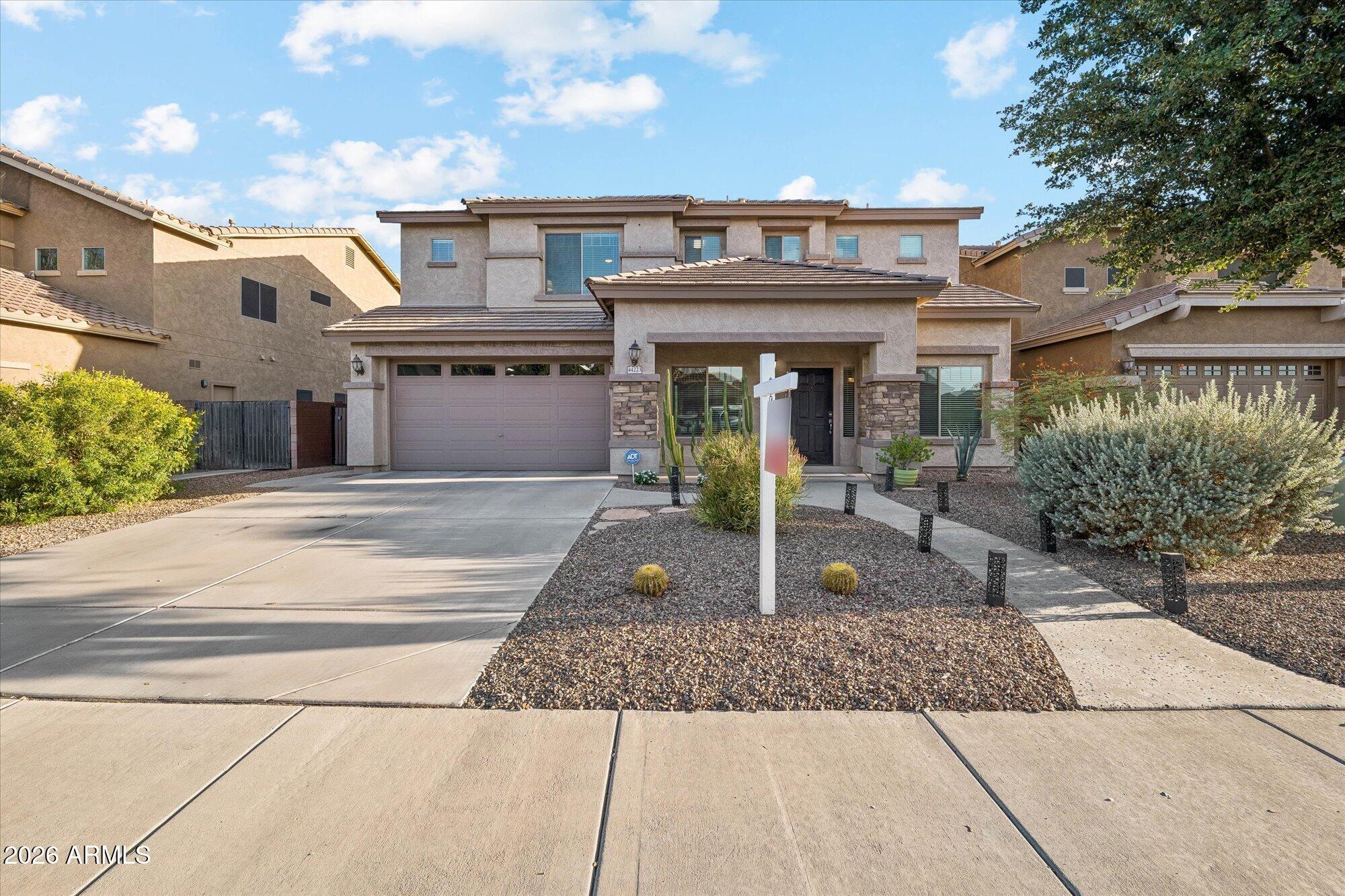 Beautifully maintained five-bdrm home with an incredible resort like backyard, Very neutral color palette with soft carpet & tile flooring throughout, an inviting living/dining room, & a cozy family room with surround sound. You'll love the eat-in kitchen featuring a pantry, stainless steel appliances, wine cooler, granite counters, double ovens, and beautiful tall maple cabinetry - some with glass doors. One bedroom downstairs with a double door entry.  The main bedroom upstairs is good size and has an ensuite with a dual-sink vanity, & separate tub/shower as well as a large walk-in closet. A generously sized loft provides flexible space for a media room or play area!  The three-car tandem garage boasts epoxy floors, air conditioning, and a rear garage door exiting to the amazing backyard The backyard is an oasis with a full-length covered patio, incredible  sparkling pool with waterfall and slide, gas fireplace, and golf tee.  Truly feels like a resort.