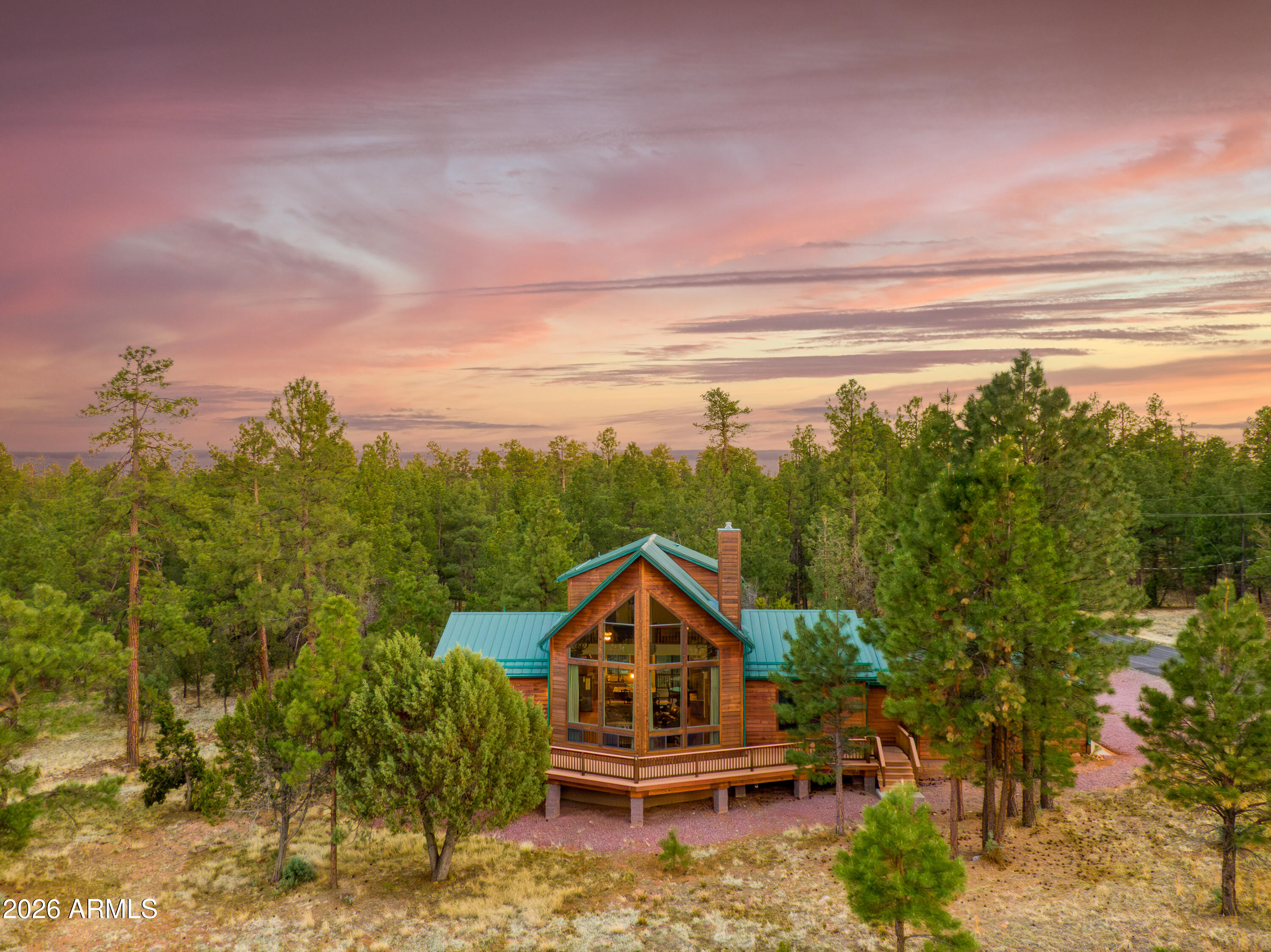 There's something different about this place. Maybe it's the way the A-frame cuts into the sky just right. Maybe it's the way the light spills through the tall windows in the morning, or how the pine trees seem to wrap around the home like a well-kept secret. Whatever it is, it works! Sitting on a private corner lot in Tamarron Pines, this cabin leans into everything you love about being in the woods: quiet mornings, crisp air, and space to actually breathe. Inside, you'll find a wide-open living area with a stone fireplace that steals the show, a kitchen built for group meals and late-night snacks, and an upstairs loft that's just the right amount of tucked away. Bonus: the loft isn't just for looks, it comes with a full bathroom, too. Step outside and you're met with options, two overed decks for lounging in the shade or staying dry when the weather rolls in, and a big open deck perfect for grilling, stargazing, or doing absolutely nothing at all. It's laid-back, low-maintenance, and already proven as a successful Airbnb. You're also just minutes from national forest access, hiking trails, and endless outdoor recreation. Whether you're looking for an income-producing property or a place to unplug without sacrificing comfort, this one hits that rare balance of charm, function, and location. And it does it without trying too hard.