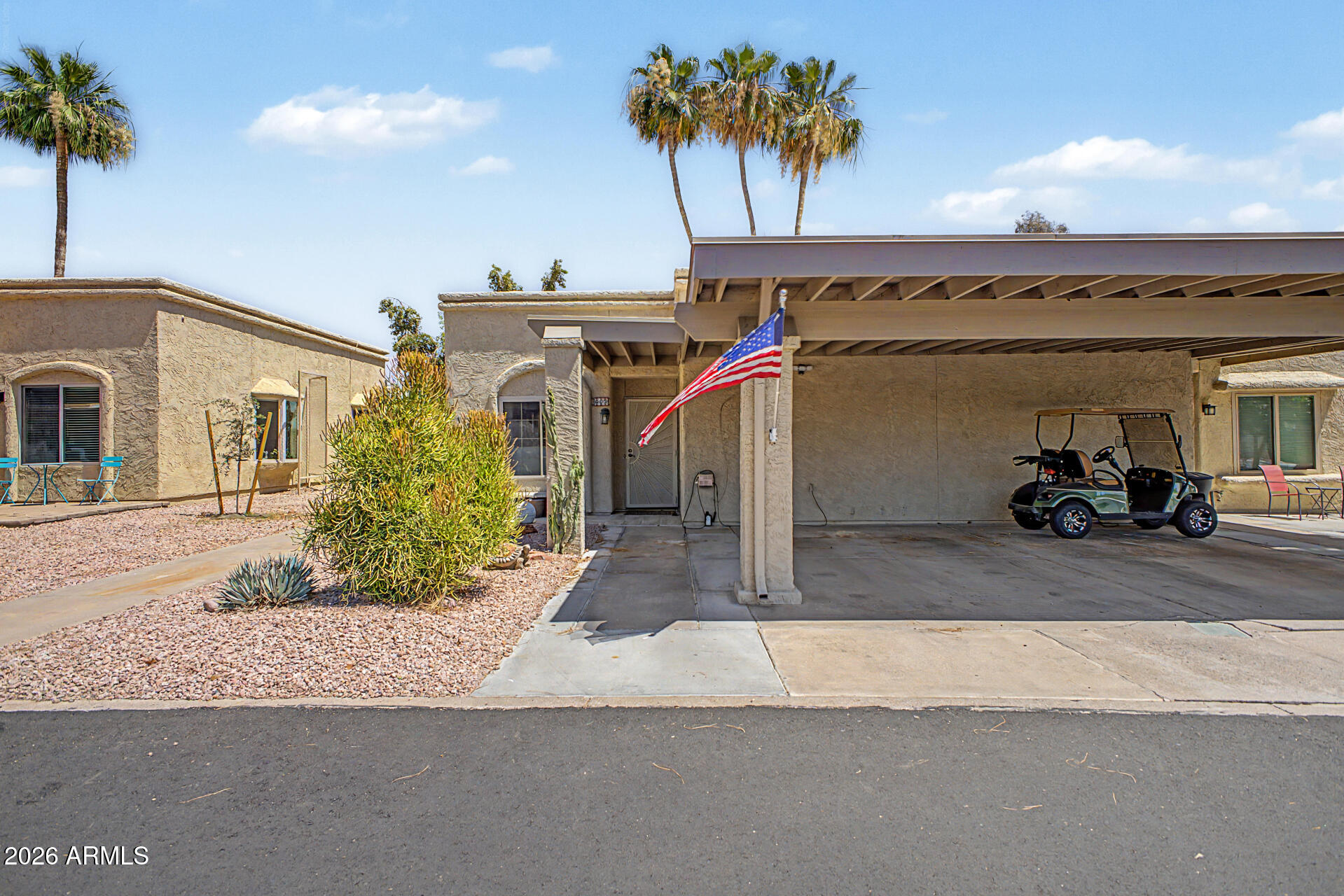 Updated 2-bedroom golf course townhome with carport parking in a desirable community! Features upgraded kitchen with quartz counters, stainless steel appliances, LV wood flooring, updated AC system, and replaced electrical wiring. Bright open floor plan with spacious primary suite and private patio access. Enjoy the covered south-facing patio overlooking the golf course -- perfect for relaxing Arizona mornings and sunsets. Washer & dryer included. Super clean, move-in ready, and close to community amenities, shopping, and dining!