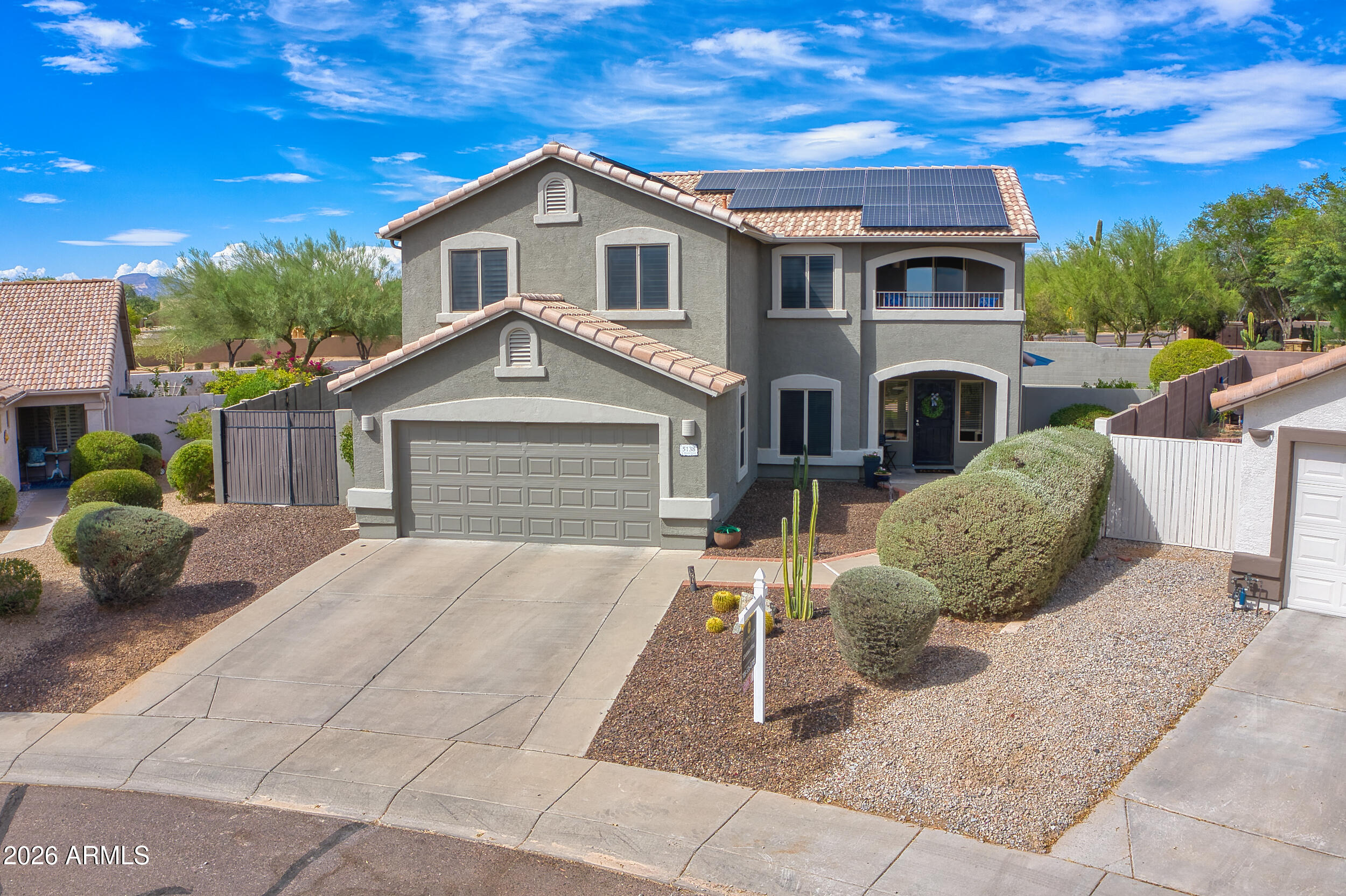 Welcome home to refined desert living in the heart of Cave Creek. Updated property features year old A/C units, a sparkling private pool, hot tub, and a spacious curved lot with plenty of room for entertaining, sports, and storage. Inside, tile flooring flows throughout, while the beautifully remodeled kitchen showcases custom cabinetry, quartz countertops, and generous gathering space. The large den offers flexibility for a home office, media room, or zen retreat. Enjoy Arizona sunsets from the private balcony or relax beneath the expansive covered patio. A filtered pet passageway adds everyday convenience for your furry family. Minutes from downtown Desert Ridge and Cave Creek's dining, shopping, art galleries, and Western charm, this home offers the perfect blend of luxury and comfort.