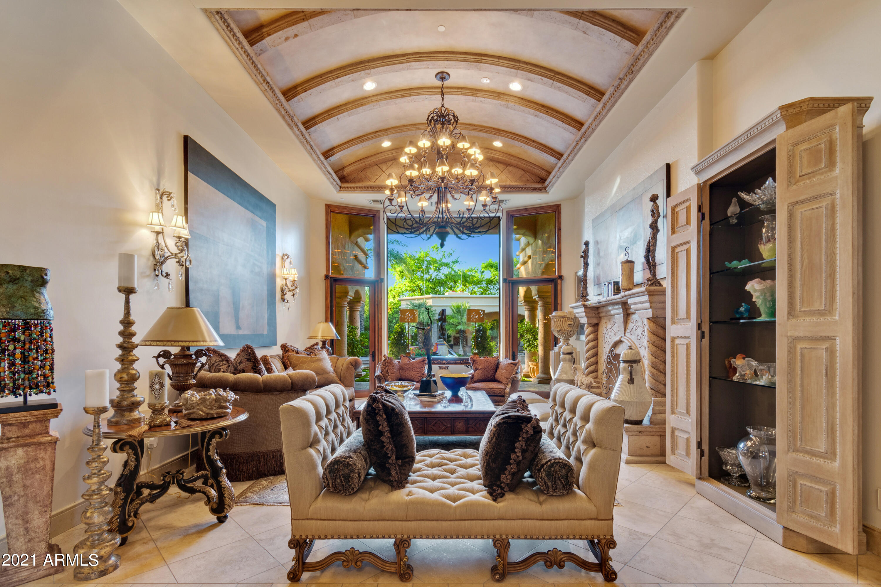 Situated in the heart of PV, this magnificent gated Santa Barbara villa truly has it all.  Upon entry, you feel a sense of warmth & elegance-from the marble floors to the large & welcoming open Chef's kitchen with butler's pantry.  The property features four lavish bedrooms and six bathrooms , a fabulous home theater, plus a separate bar/lounge room to rival any five star restaurant ! The  attention to detail seen throughout this home are truly astounding- featuring high intricate ceilings, custom stonework, alder wood & venetian plaster throughout. The backyard  features covered patios, a pergola, ramada, outdoor kitchen & fireplaces- the perfect setting for casual outdoor entertaining to formal events, and everything in between. The home is nestled by mature impeccably landscaped lush gardens -truly your perfect tranquil desert oasis !