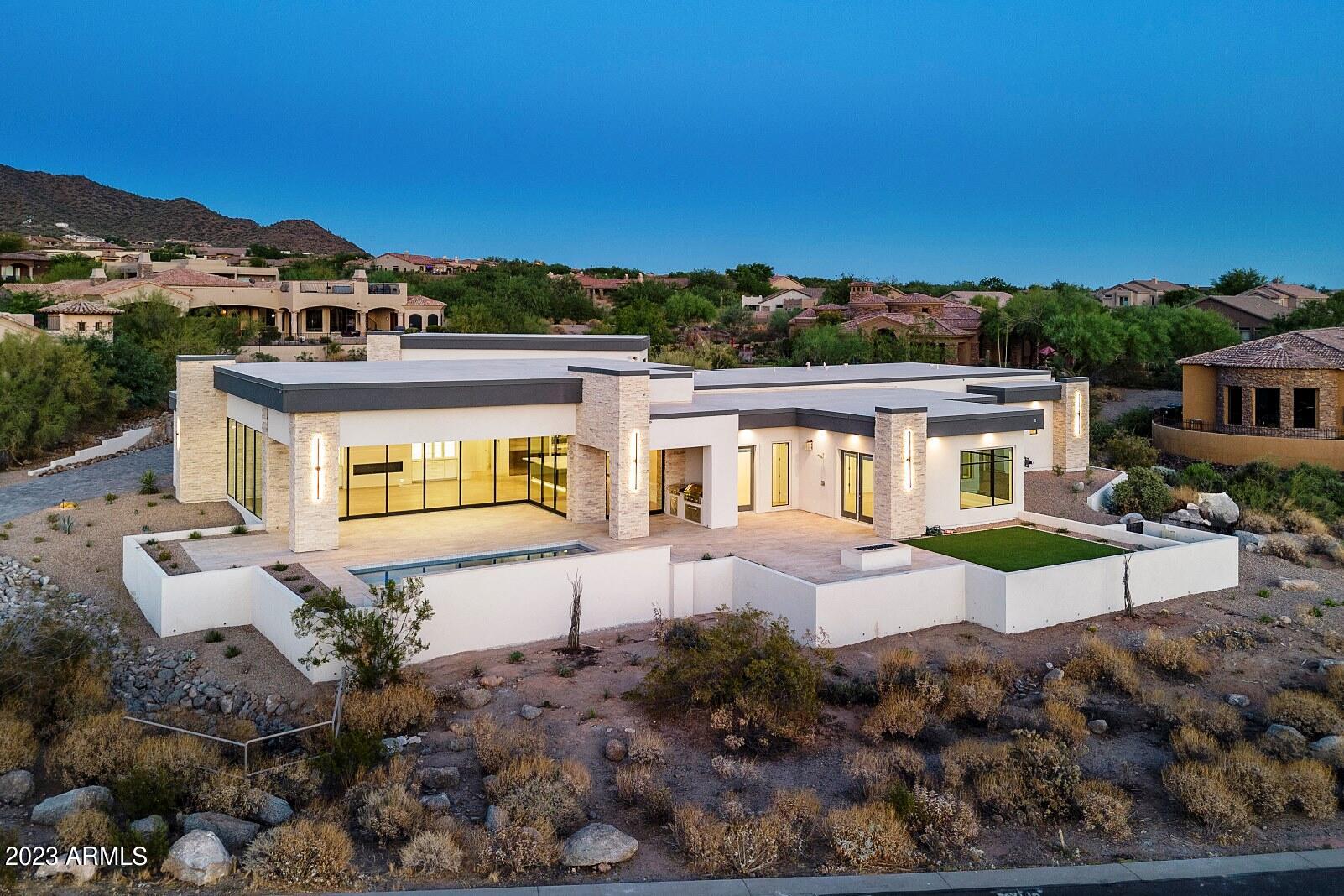 Incredible Desert Modern Home to be completed June 2023. This luxury custom home has been meticulously crafted to capture amazing views on a 3/4 acre parcel. Incredible oversized air conditioned garage with 3 extended bays plus an oversized RV garage,storage room & 50A car charging station. Stunning open plan features 37 feet of multi-slide stacking glass walls overlooking the patio, heated pool & Red Mtn & sunset views. Gourmet kitchen with oversized island, separate 36'' SubZero refrigerator & freezer, 4 burner gas cook top + 4 burner induction, double ovens & quartzite counters. So many upgrades including highly rated insulation throughout, synthetic stucco, 16 SEER HVACs, LED lighting & Anderson Windows. Luxury and quality at its finest!