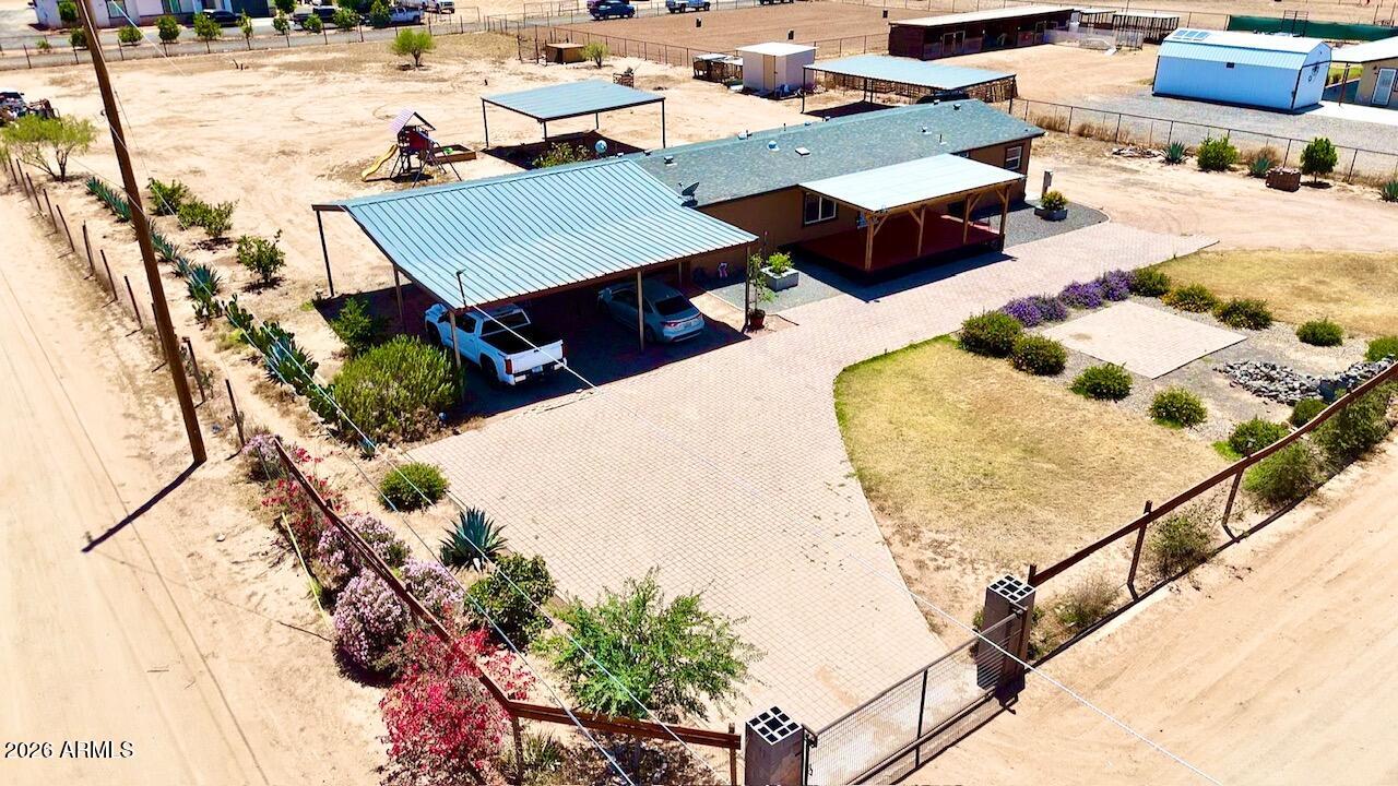 NO HOA HORSE PROPERTY in a fast growing area! This beautifully updated 1.24-acre property offers endless potential and plenty of room to spread out. The home features 4 bedrooms and 2 bathrooms with a spacious living and dining area, tile flooring in the main areas, carpet in the bedrooms, neutral paint throughout, and vaulted ceilings and skylights that give it a light, open feel. Did we mention all of the SPACE? 1.24 ACRES!!! Plenty of covered parking, 3 rolling RV Gates all on a corner lot to fit all of your needs!! Now is the time to take advantage of these prices before rates drop and prices go back up!! Easy comp is the neighbor to the West who just sold for more than our asking price with less upgrades!
