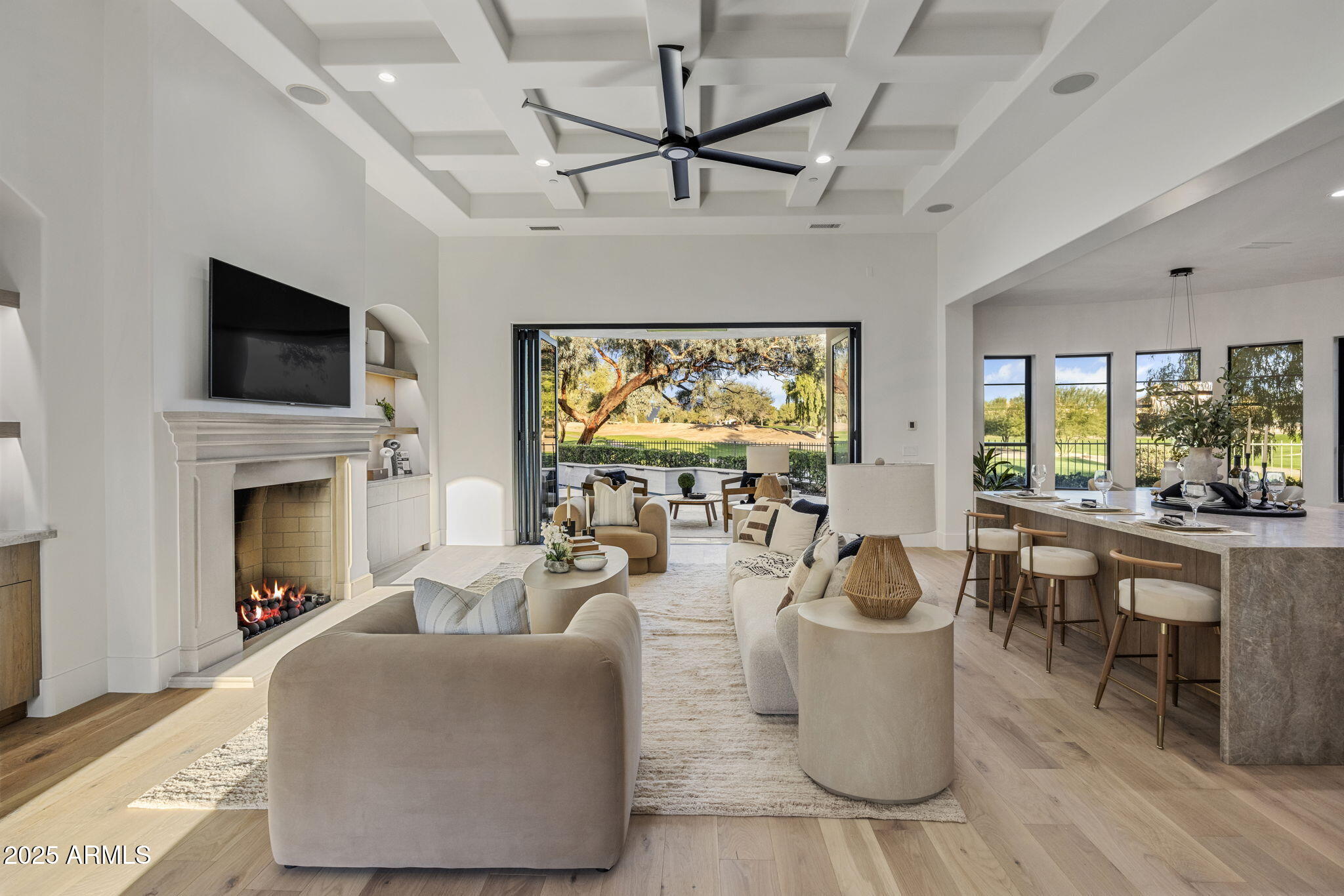 Experience elevated living in this gated, beautifully reimagined 4BR/3.5BA luxury home overlooking the private 6th hole of the Gainey Ranch Dunes Course. A serene courtyard entry opens to 4,230 sq ft of refined organic minimalism with white oak floors, Lutron smart features, and accordion glass doors. The main level showcases a sophisticated primary suite, ensuite guest room, and office, with two additional bedrooms and a loft upstairs ideal for family & guests or work-from-home flexibility. The chef's kitchen dazzles with double quartz islands, Sub-Zero appliances and wine tower, Wolf range, and wet bar. Outdoors, enjoy a resort-style heated saltwater pool, spa, Bromic heating, built-in BBQ, and breathtaking fairway and mountain views. A 3-car garage completes this exceptional retreat.