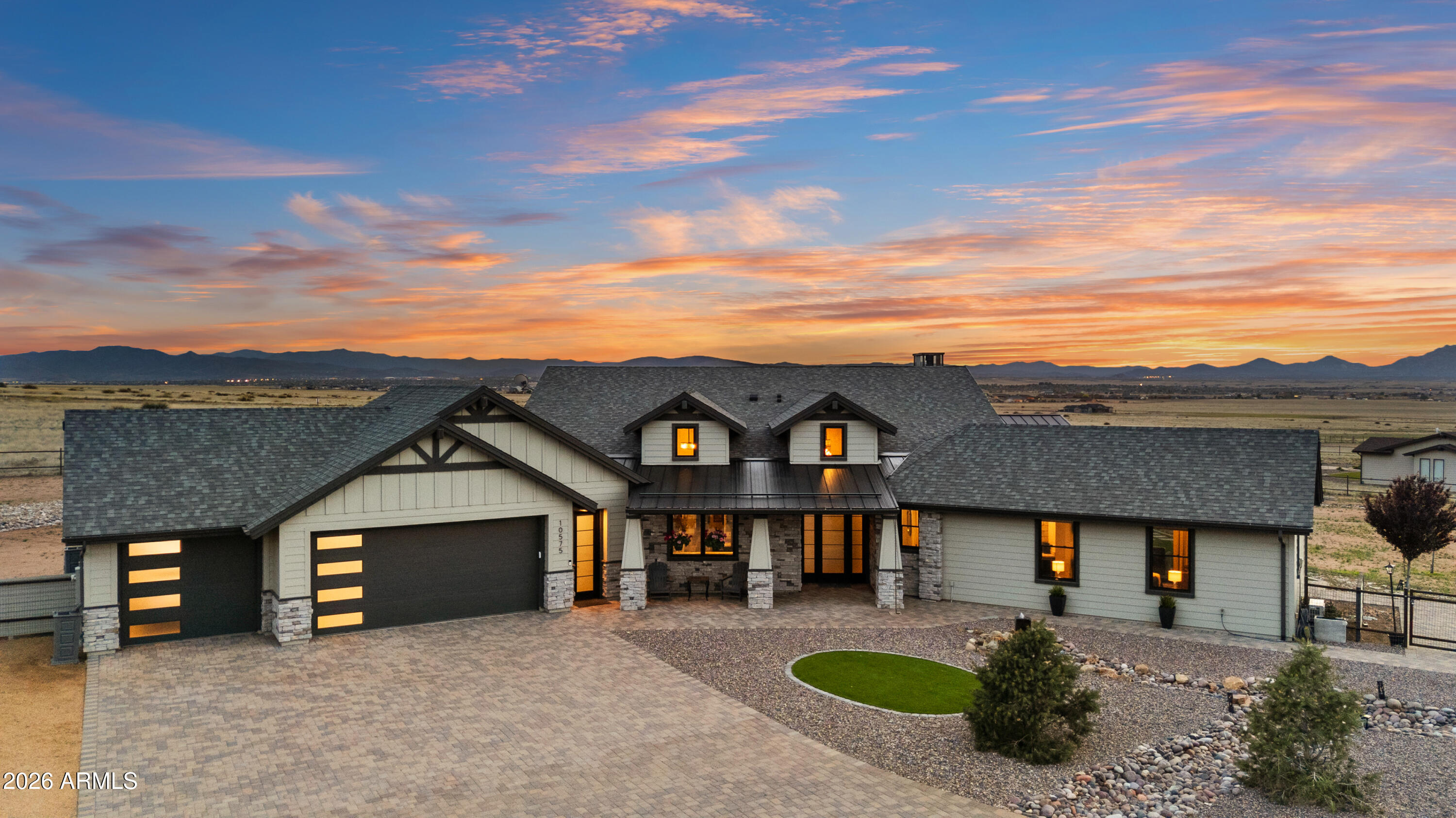 Remarks
Behold the pinnacle of high-desert living in this 3,178 sq-ft architectural masterpiece, where industrial elegance meets the rugged beauty of Prescott. Perfectly positioned on two meticulously manicured, fully fenced acres, this 3-bedroom plus office, 3.5-bath estate was masterfully designed so that every window frames Prescott's most iconic views. This estate is perfect as a full-time residence or a secure lock-and-leave for those seeking a luxury escape from the Phoenix heat. Enter through private electric gates to a grand arrival featuring RV parking, a bubbling rock fountain, and sophisticated metal roof accents. The home is powered by 400-amp service (RV garage ready) and a 24k generator. The heart of the home is a culinary atelier boasting a massive island topped with exotic Remarks
Behold the pinnacle of high-desert living in this 3,178 sq-ft architectural masterpiece, where industrial elegance meets the rugged beauty of Prescott. Perfectly positioned on two meticulously manicured, fully fenced acres, this 3-bedroom plus office, 3.5-bath estate was masterfully designed so that every window frames Prescott's most iconic views. This estate is perfect as a full-time residence or a secure lock-and-leave for those seeking a luxury escape from the Phoenix heat. Enter through private electric gates to a grand arrival featuring RV parking, a bubbling rock fountain, and sophisticated metal roof accents. The home is powered by 400-amp service (RV garage ready) and a 24k generator. The heart of the home is a culinary atelier boasting a massive island topped with exotic leathered Montecristo granite--one of six full slabs used throughout. This gourmet space features Café appliances, a Thor beverage fridge, a pot filler, and custom brick backsplashes, flowing into a sophisticated morning kitchen. The split floorplan ensures total seclusion. In the family room, soaring Pella sliding glass doors lead to multiple covered patios and an entertainer's paradise with a dual-sided fireplace and an incredible outdoor kitchen. The primary sanctuary offers a freestanding soaking tub, a rainfall shower, and a private garden terrace with a secluded outdoor shower. Guests enjoy unrivaled privacy in a separate wing with a mini-kitchen bar and dedicated mini-split--ideal for an in-law suite or caregiver quarters. Built with uncompromising integrity, the home features full spray foam insulation, an electric furnace, and an oversized 3-car drive-through garage. Experience unrivaled prestige and comfort. WELCOME HOME!