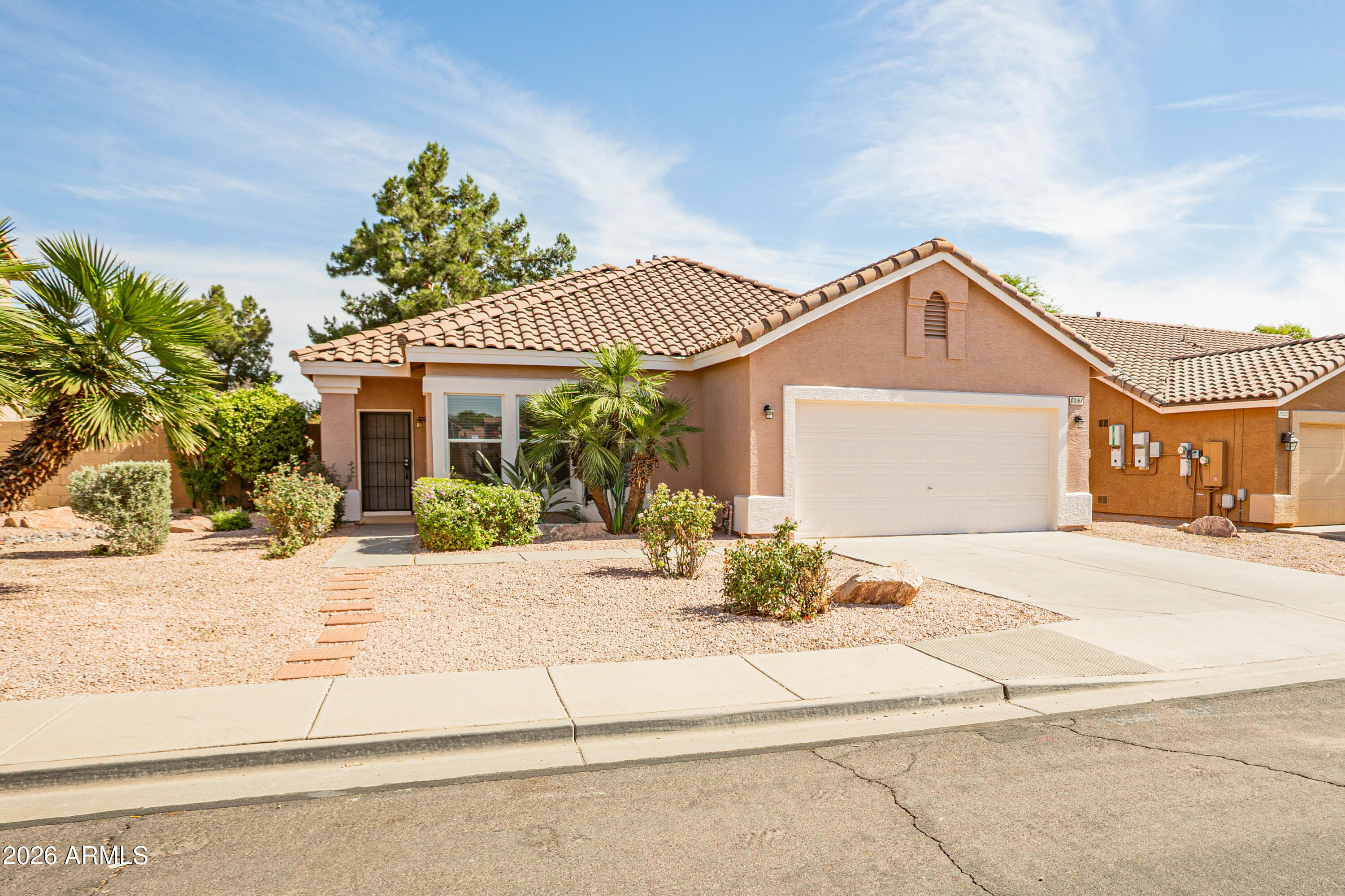 Location truly seals the deal! Backing directly to a peaceful green space and park with no rear neighbors, this move in ready home offers the perfect blend of comfort, convenience, and privacy. Ideally located just minutes from the Loop 202 & 60 freeways &  within walking distance to Boulder Creek Elementary School, homes in this location do not last long.
Fresh interior and exterior paint, brand new carpet, and refreshed landscaping give the home a clean, updated feel from the moment you arrive. Inside, you'll find a spacious 4-bedroom split floor plan designed for both privacy and functionality, anchored by an open-concept great room perfect for entertaining or relaxing after a long day.The kitchen features granite countertops, SS appliances and an island ready for you to entertain.