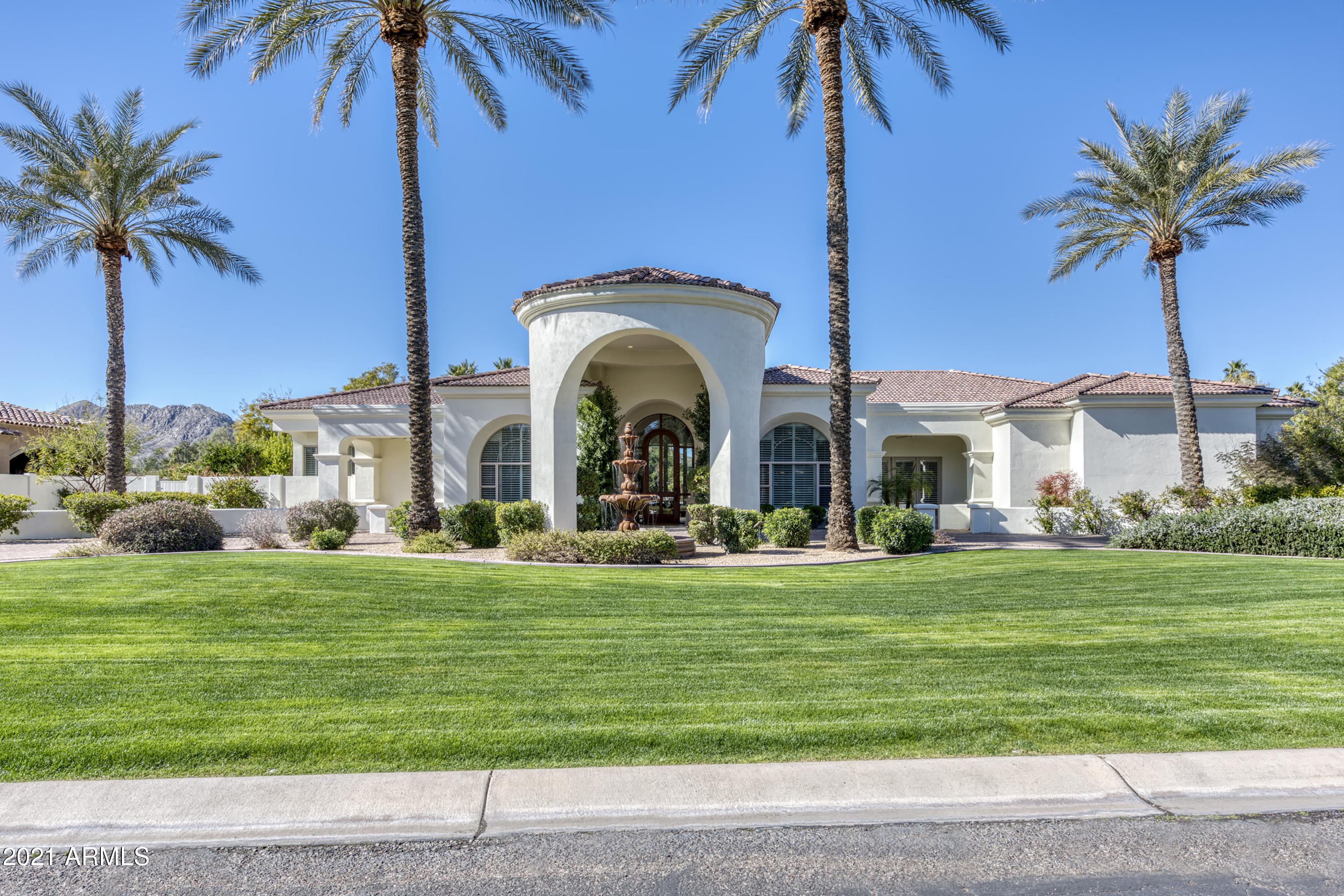 ''Hidden Paradise'' A Premier gated community in the heart of Paradise Valley. This home has an exceptional floor plan which boasts 6 Bedrooms (all en suite) and 7 baths. All have walk in closets and private patio's. The grand entry has stone columns and 20' plus ceilings. Master suite includes, fireplace, sitting area w/ wet bar, his and her walk in closets, his and her water closets, fitting area, flex room for work out/massages, private exit to pool and spa. Oversized living room w/ stone fireplace is perfect for large gatherings. Kitchen open to family room with fireplace. Supersized media / game room with full bar. Separate detached fully equipped guest casita. Ext. length 4 car garage. Ext. features incl. Heated pool and spa with water feature. Citrus Grove all very private and quiet