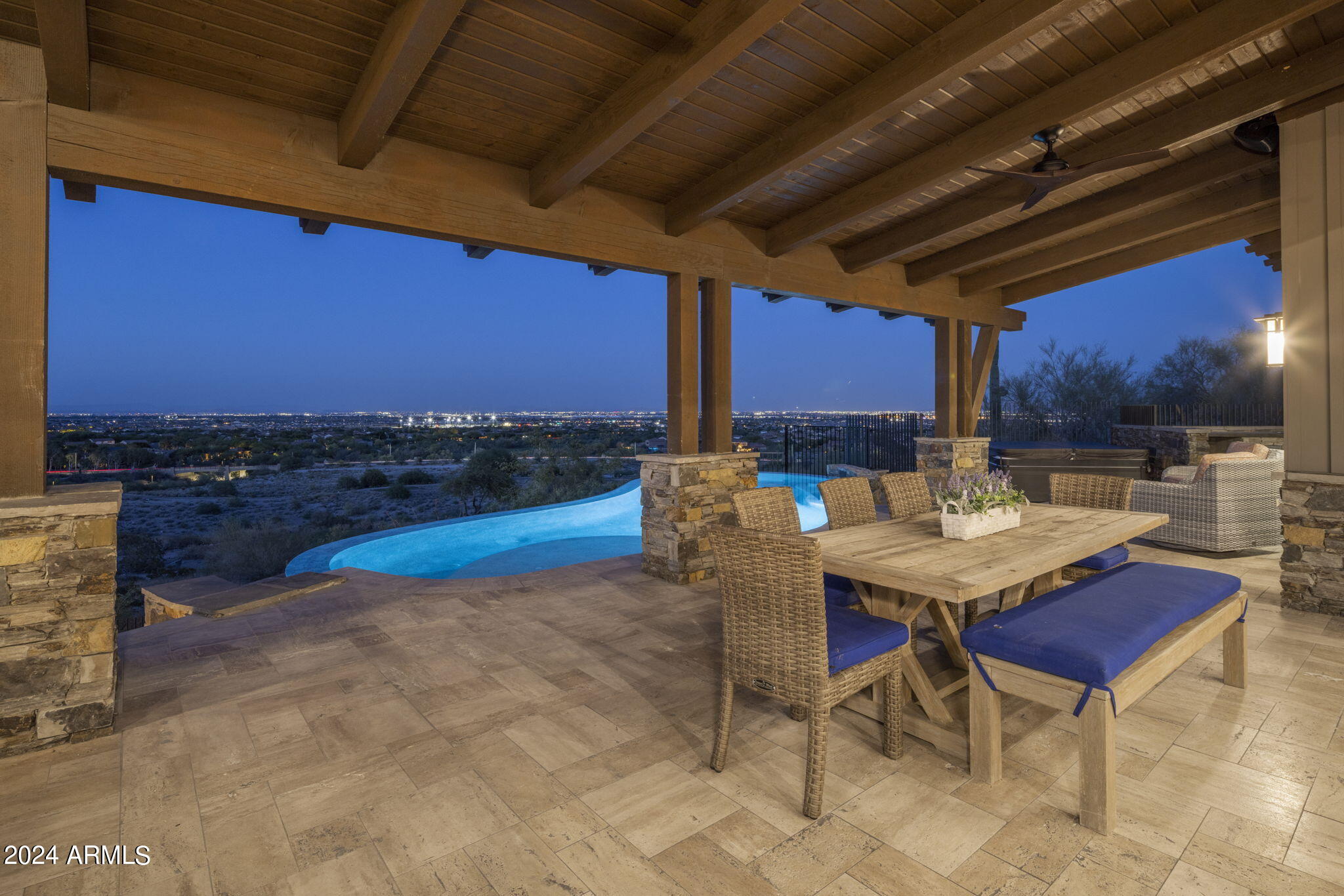 REDUCED $200K ** Entertainers Dream Home ** Truly majestic home overlooking the White Tank Mountains and Verrado Founder's Golf Club's 2nd, 3rd, and 8th Holes.  Views stretch to Glendale's Cardinal Stadium and downtown Phoenix.  This lodge-style home has 7215 SF of spacious living on two levels including 5 bedrooms each with ensuite bathrooms. Also an exercise room, office, winding staircase, HUGE media room and bar.  Yes, even an elevator, negative edge pool, spa and BBQ grill - wow!  Double island kitchen w /Wolf and SubZero. Windows everywhere for bright, open feel. *Even pick your own flooring* 270 degree views from your wrap around patio deck will stun you on this perch high above Verrado like no other home west of Phoenix.  You'll know as you drive up, this is your new home!