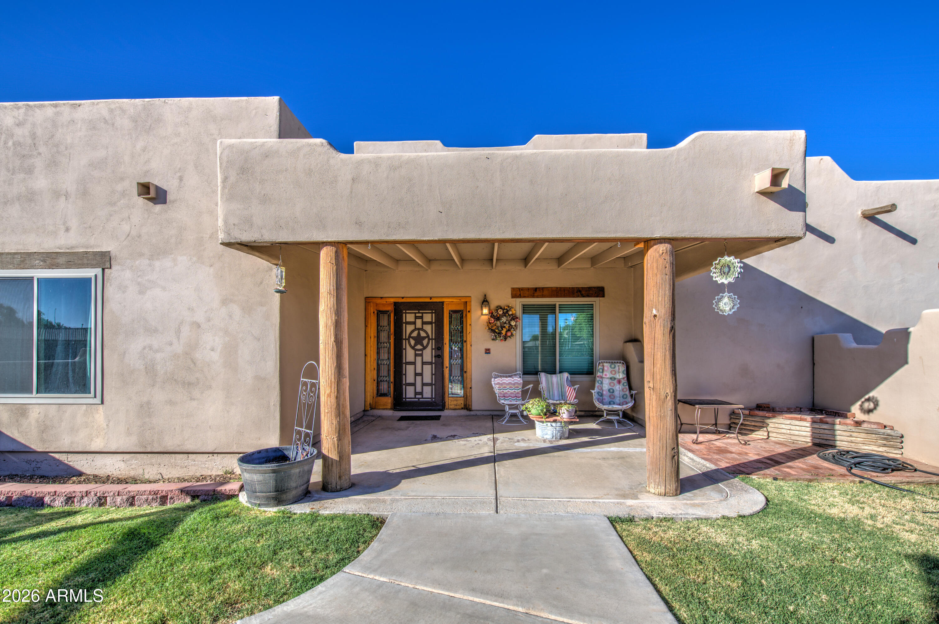 Experience the charm and character of this beautifully designed Santa Fe-style home situated on a spacious 1.25-acre irrigated lot with valuable irrigation rights. This unique property features 3 generously sized bedrooms and 3.5 bathrooms, with each bedroom offering its own private full en-suite bathroom for maximum comfort and privacy. The inviting floor plan blends timeless Southwestern architecture with functional living spaces, making it ideal for both everyday living and entertaining. Enjoy the freedom of expansive outdoor space with endless possibilities for horses, gardening, RV parking, workshops, or creating your own backyard retreat. Conveniently located near a variety of shopping, dining, entertainment, and major freeway access, this property offers the perfect balance of peaceful country-style living with city conveniences just minutes away. Don't miss this rare opportunity to own a distinctive home with acreage, irrigation rights, and an unbeatable location.