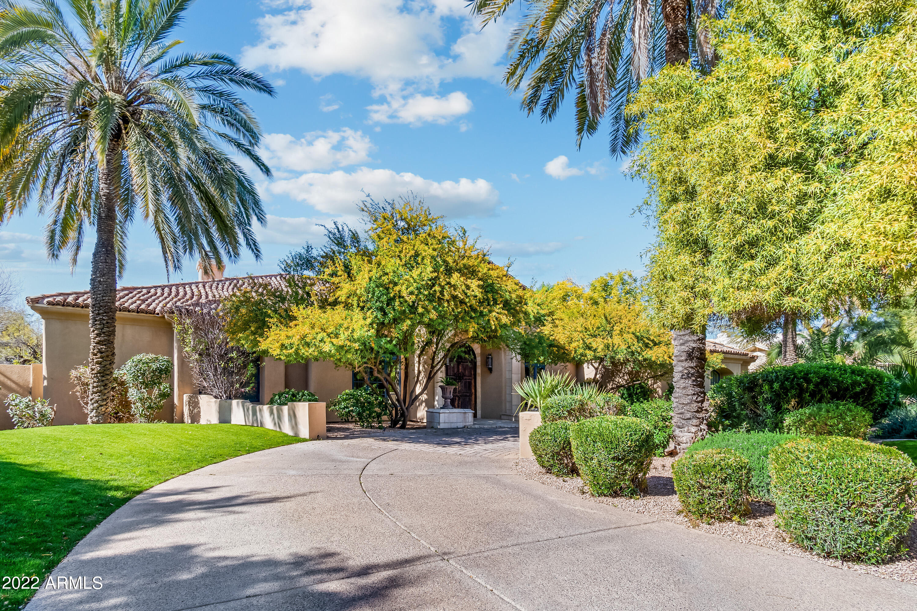 Situated in best part of Paradise Valley- this luxury home includes a Chef's kitchen, state-of-the-art home theater, sports court, game room with pool table, pool/spa, exercise room, guest house and huge lawn area. The heated pool has a swim up bar to the BBQ area.   3 en-suite bedrooms in the main home and separate casita with full kitchen, living area and bedroom. This is the perfect estate for relaxing and entertaining- Don't  miss it!