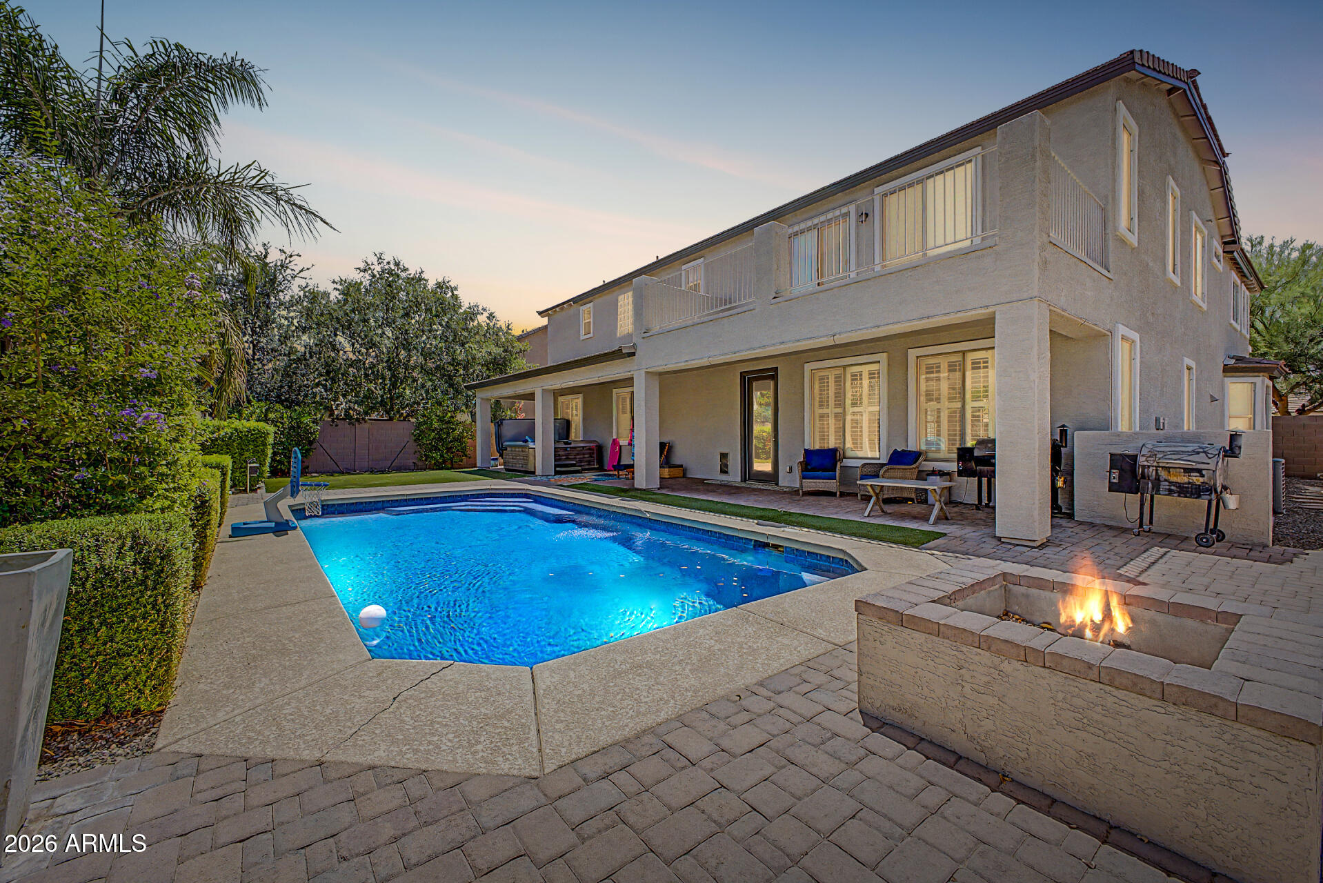 WOW -- check out the price per square foot on this one!! This Marbella Vineyards beauty may be one of the BEST values in Gilbert.
Featuring one of the neighborhood's most desired floor plans with TWO primary suites, this home offers incredible flexibility for multi-generational living, guests, or even future separate guest quarters.
Step through the double-door entry into a spacious foyer, formal living area, and open den overlooking the courtyard. The heart of the home is the oversized family room and expansive kitchen -- with abundant counter space and cabinets.
Downstairs, you'll find a second primary suite complete with a sitting room, walk-in closet, and full bath. Upstairs offers a large loft with built-in desk, plus a stunning primary retreat featuring: a sitting room, walk-out balcony, and dual closets. The third upstairs bedroom also includes its own ensuite bath and spacious closet.
And the backyard? Absolutely picture perfect. Enjoy a sparkling pool, turf, huge covered patio with misting system, fire pit, spacious side yards, and raised planter boxes.
Located within walking distance to Gilbert Regional Park with its splash pad, pickleball, volleyball and tennis courts, playgrounds, and even more exciting amenities coming soon.
This home truly has SO much to offer -- and at this price per square foot, it's an opportunity you don't want to miss!
Note: New AC, New Anderson windows on S and W sides, new exterior paint
Note: Master suite is easily converted into bedroom 5 if needed.