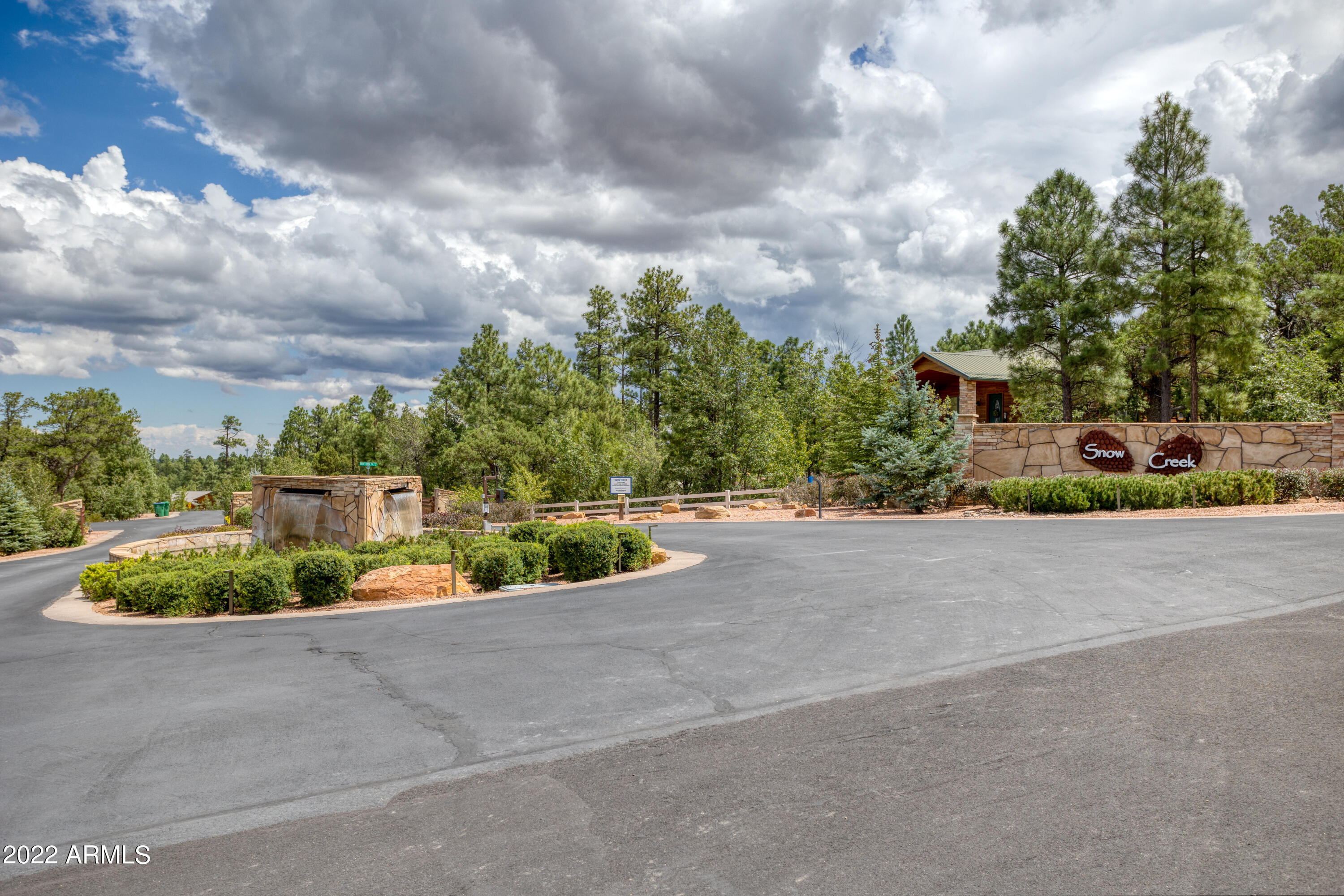 Huge lot in the highly sought after GATED Snow Creek subdivision on a private cul-de-sac!  Many of the Homeowners purchased 2 or more lots and combined them into one Lot for extra privacy. Beautiful Custom homes throughout! Maintained Walking Trails throughout & extensive Open Space. Low HOA dues & such a great location! . Improvements include paved streets and underground utilities including power, telephone & cable TV, natural gas and City water & sewer. Easy access to shopping & restaurants! Walking distance to the National Forest!