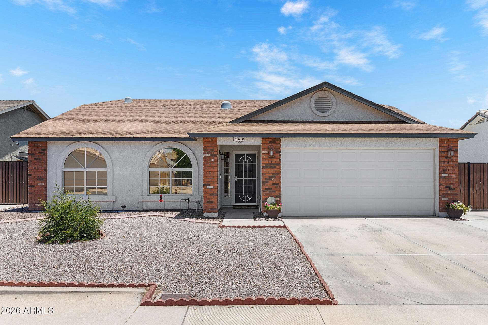 NEW AC, NEW FLOORING & NO HOA! This move-in ready home features a new AC system (2026) with 10-year warranty, new luxury vinyl plank flooring (2025), new carpet (2026), custom window treatments in every room, new induction range with built-in air fryer and pizza maker (2026), water heater, freshly updated interior paint, new front door, 240V outlet for electric vehicle charging, & sunscreens on all windows. Inside, vaulted ceilings & abundant natural light create an open feel throughout the main living area. The living room flows seamlessly into the updated kitchen showcasing new quartz countertops, tile backsplash, pantry with built-in pull-out drawers, breakfast bar seating, stainless steel appliances & an eat-in dining nook with bay windows. The primary suite offers dual vanities & a shower/tub combination, while two secondary bedrooms share a full hall bath. The low-maintenance backyard features a large covered patio, separate gazebo, above-ground hot tub, RV gate with parking, storage shed, and plenty of space to customize or enjoy as-is. Conveniently located near shopping, dining, parks, recreation, hiking and biking trails, with easy access to Loop 202.