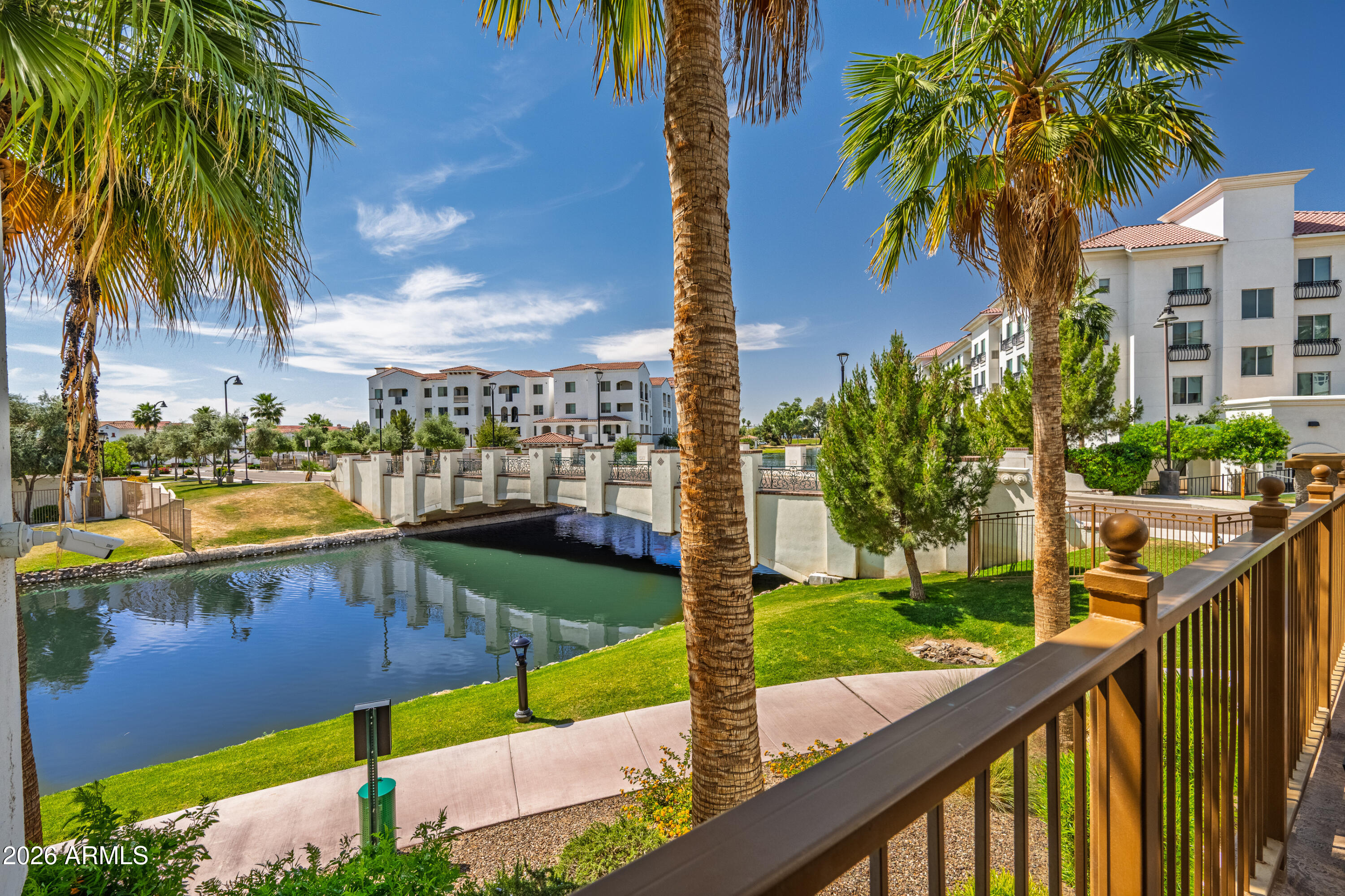 Luxury lakefront living at The Cays at downtown Ocotillo. Welcome to one of the most coveted residences at the Cays. This rare lakefront XL Bacara model offers exceptional indoor and outdoor living with an oversized 975 square foot private patio overlooking the water. Stunning first floor 2 bedroom, 2 bath plus den condo, built in 2024, features over 80,000 in builder upgrades along with over 90,000 in designer furnishings. Offered fully furnished, this is a true turnkey opportunity. Inside, enjoy a open concept layout with 9 foot ceilings, tile flooring throughout, and serene lake views.