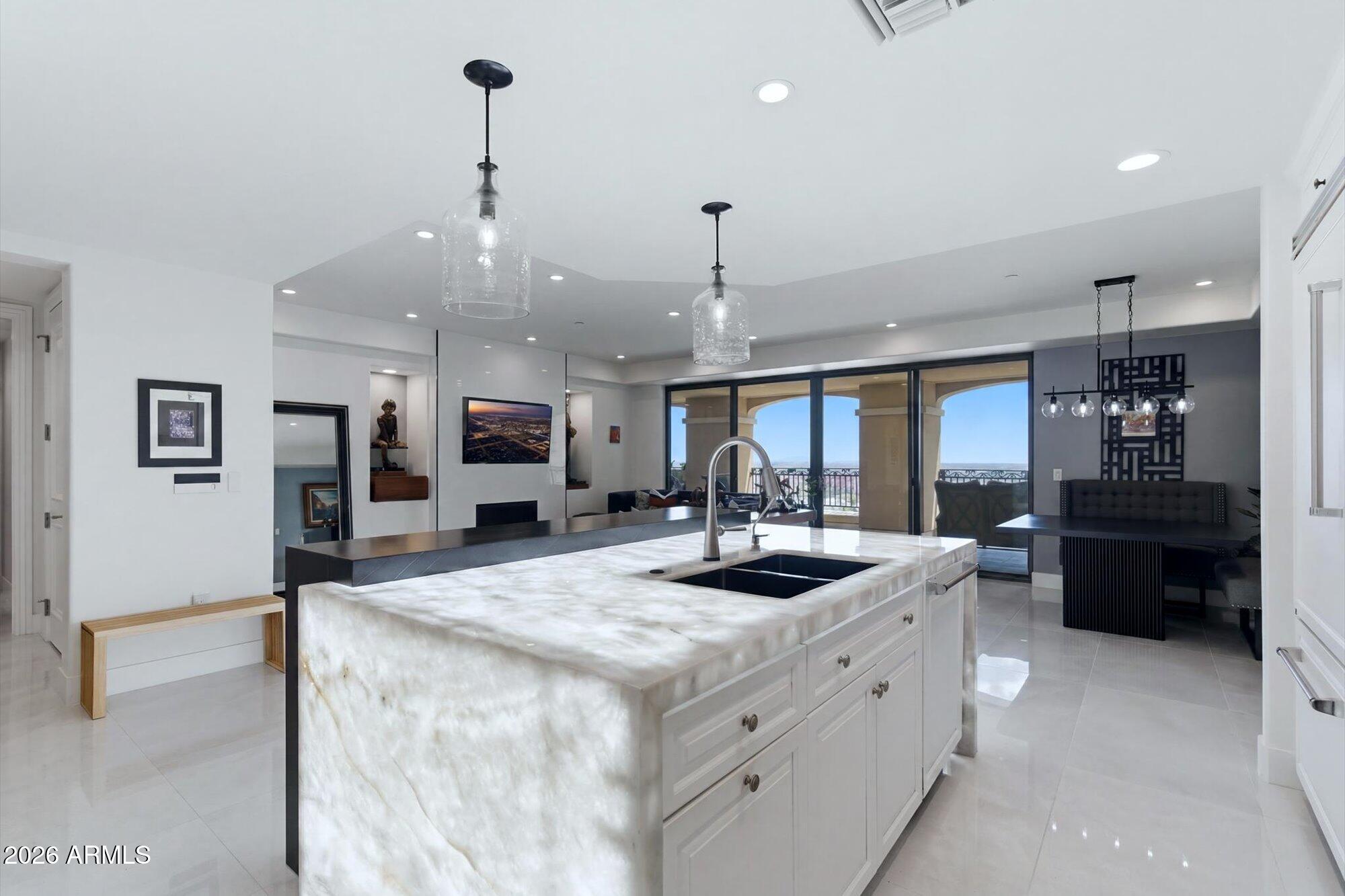 Enjoy 11th-floor living at The Scottsdale Waterfront with beautiful city-light and Waterfront views from a 40-foot covered balcony. This remodeled 2-bedroom, 2.5-bath condo with a den has been updated throughout, while keeping the view and floor plan that make this residence so desirable.

The great room and kitchen open directly to the balcony, creating an easy indoor-outdoor connection. Both bedrooms also have their own separate exits to the balcony -- one of the best features of this floor plan. The den adds real flexibility and can be closed off for privacy or opened up to feel connected to the main living space. It works well as an office, TV room, workout space, or occasional guest area.

The remodel brings a fresh, current feel with clean finishes and several unexpected upgrades