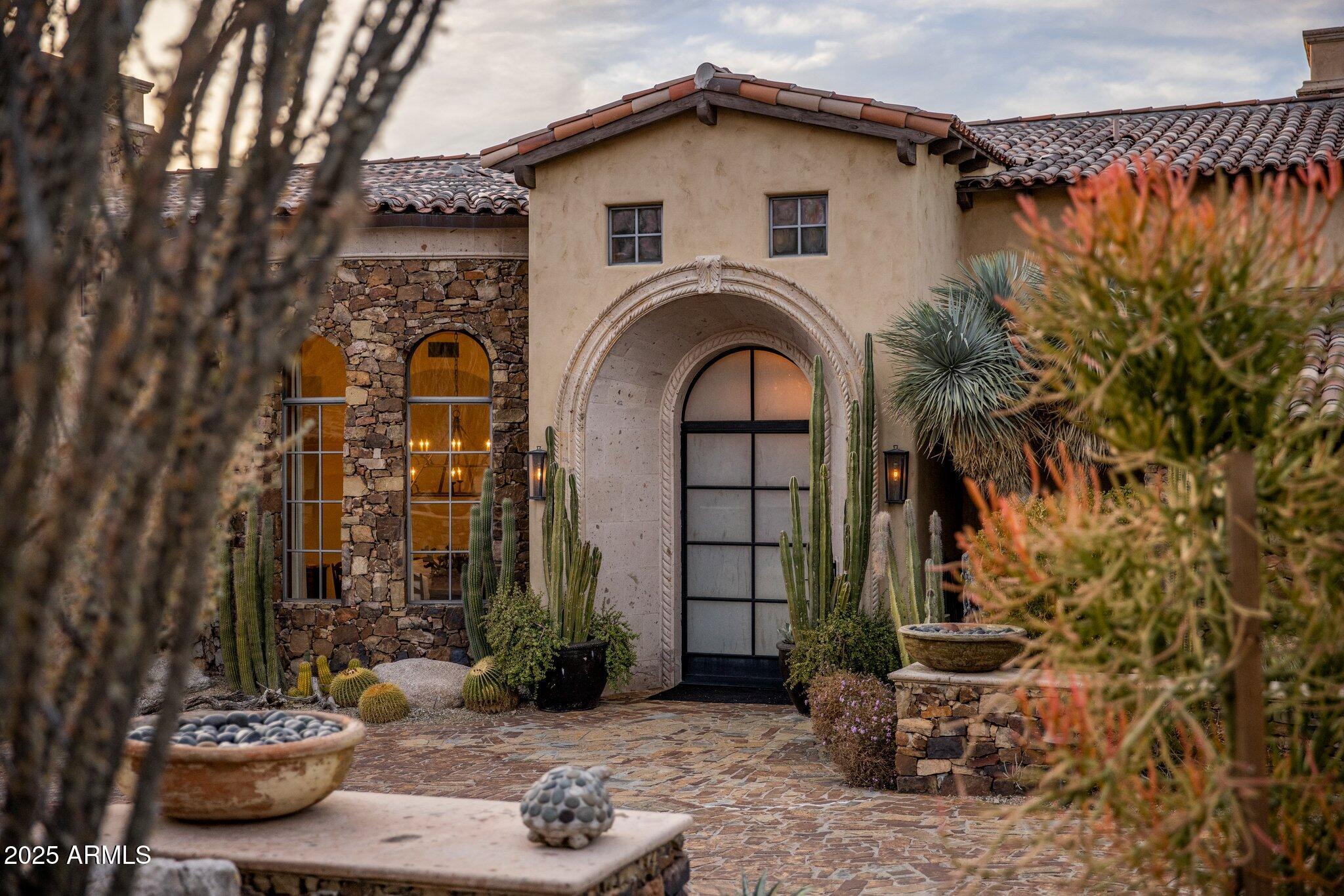 Estancia Golf Membership available subject to Board approval * Authentic Santa Barbara-style on an elevated view lot in Estancia * Recently remodeled to create a timeless, warm feel with spaces reminiscent of a luxury Montecito inn * Perfect floor plan with the master bedroom, all living areas and guest bedrooms on one level and a Junior master as the only upstairs retreat  * Amenities include a dedicated office, large theater room, massive great room with wet bar and motorized pocket door to the outdoor living room, 1000+ bottle wine cellar, detached guest house with kitchenette and a 4-car garage * Interior details include stone and wood plank flooring, carved cantera fireplace surrounds, wood beamed ceilings and custom lighting fixtures * Resort-style living *