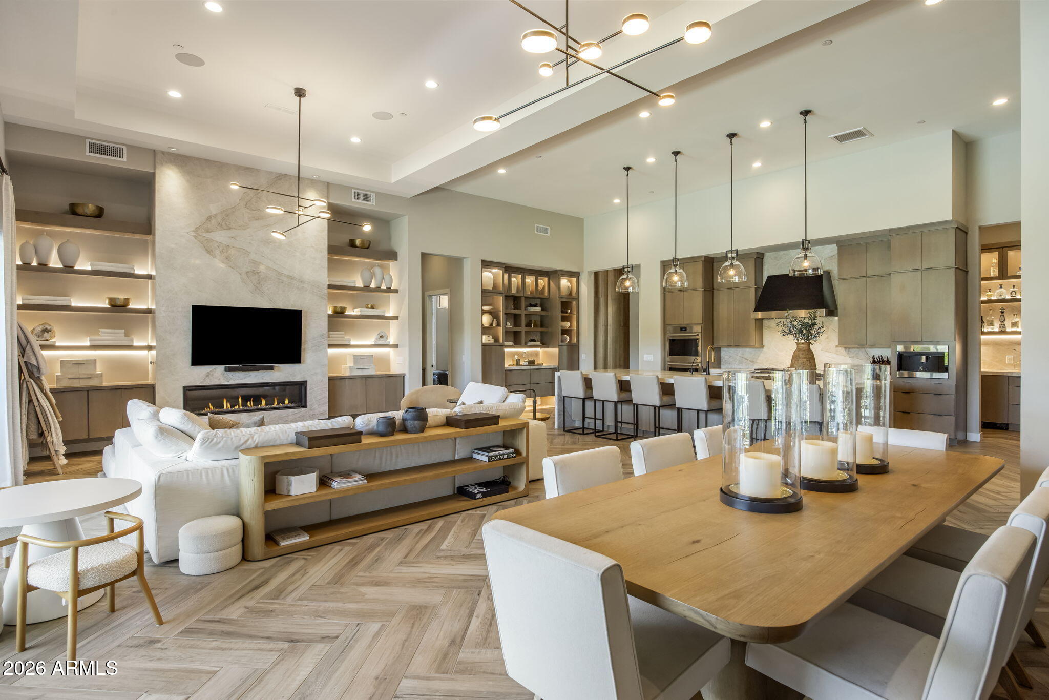Welcome to an extraordinary retreat in the exclusive gated community of Sereno Canyon. Built in 2023 and thoughtfully curated with over $1M in premium upgrades, this stunning residence offers 5 spacious ensuite bedrooms and designer finishes throughout. Natural stone countertops and statement fireplaces bring warmth and sophistication, while professionally designed interiors create a timeless luxury feel. The resort-style backyard was made for entertaining with a massive pool, spa, sunken covered lounge area, expansive grass space for kids to play, and exceptional privacy. Enjoy mountain views from the front courtyard and the convenience of a long private gated driveway. The outdoor kitchen features Twin Eagles barbecue appliances and outdoor refrigerators that have never been used. Designed for unforgettable gatherings and comfortable everyday living, this Sereno Canyon masterpiece is the perfect home for large families and those who love to host in style.